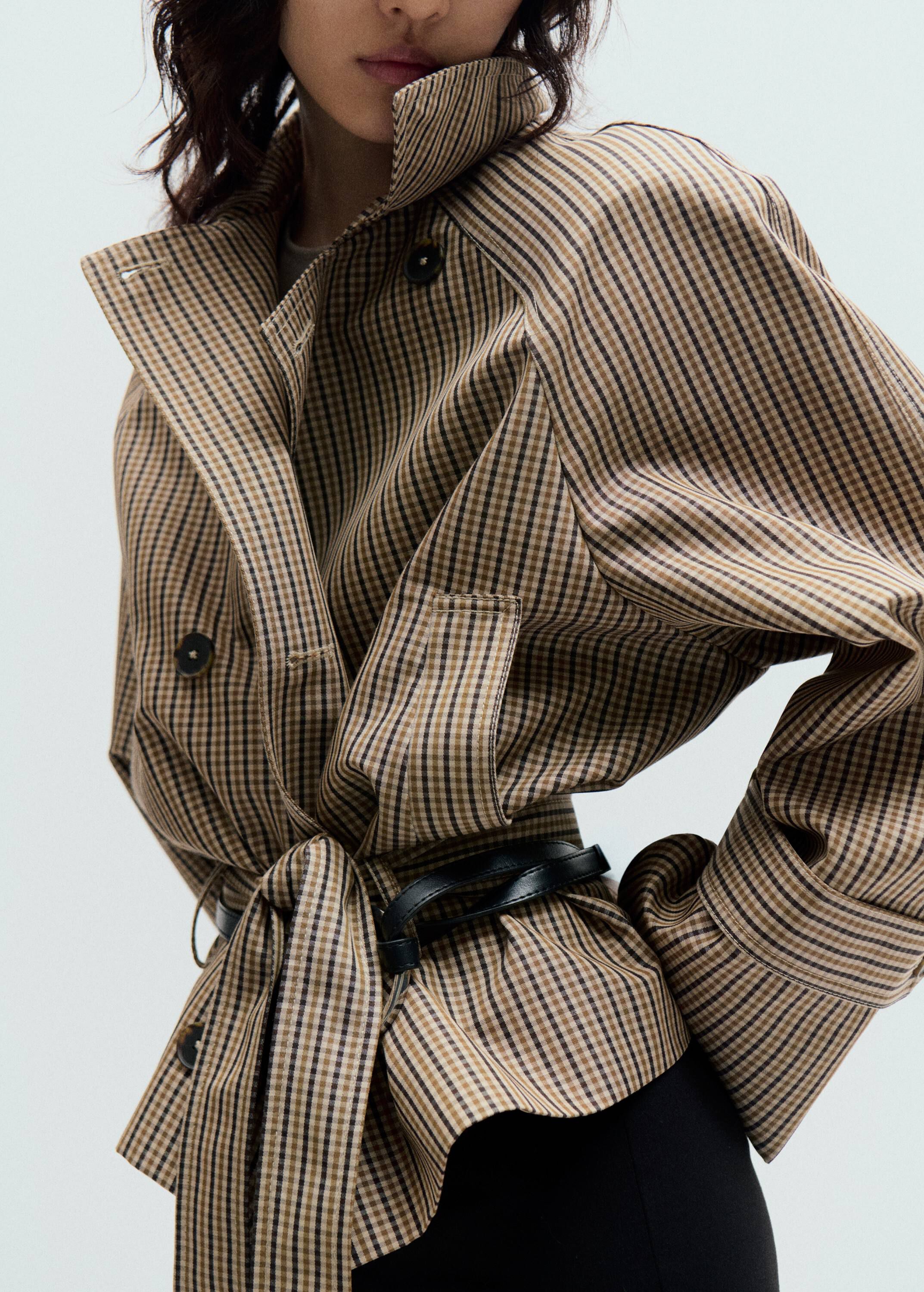 Short checked trench coat with belt