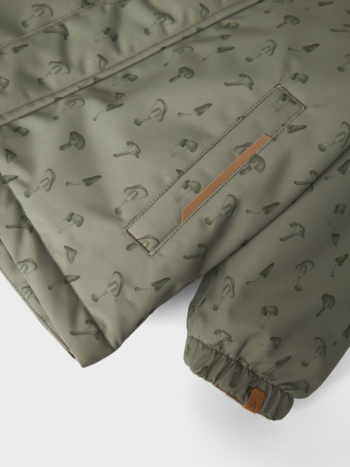 NMMLASNOW10 JKT FO AOP1 LIL