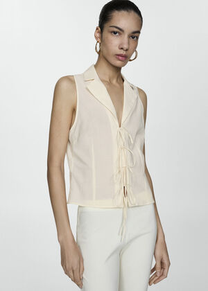Sleeveless blouse with bows
