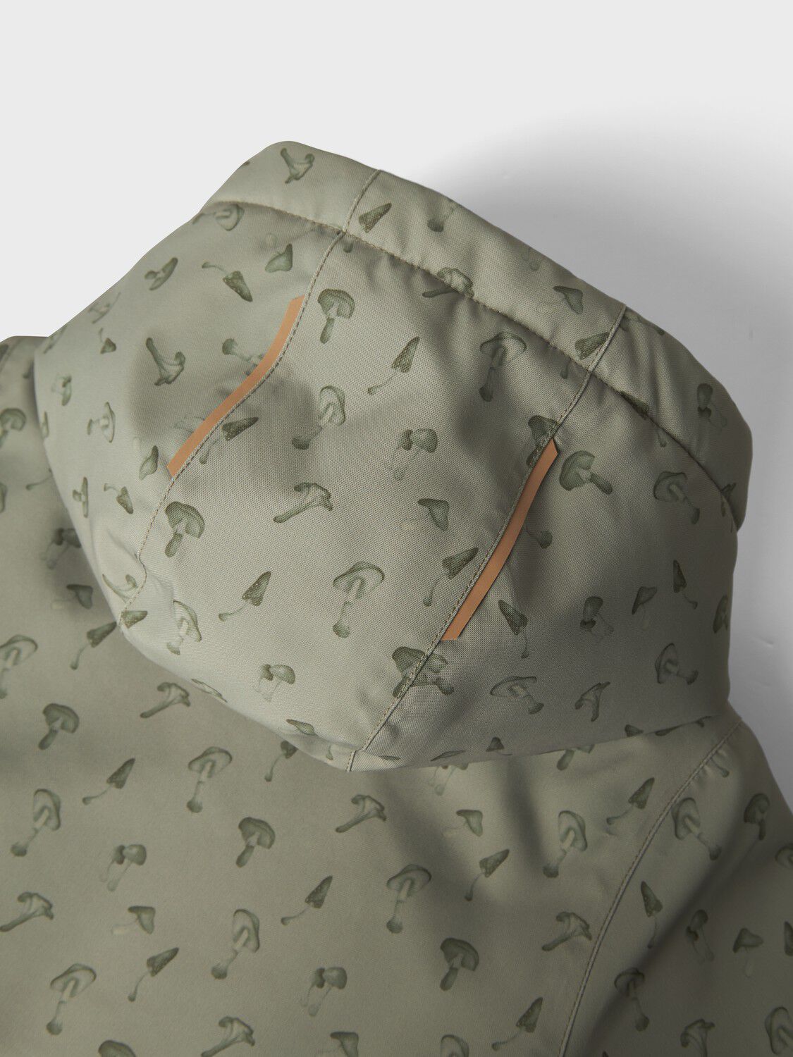 NMMLASNOW10 JKT FO AOP1 LIL