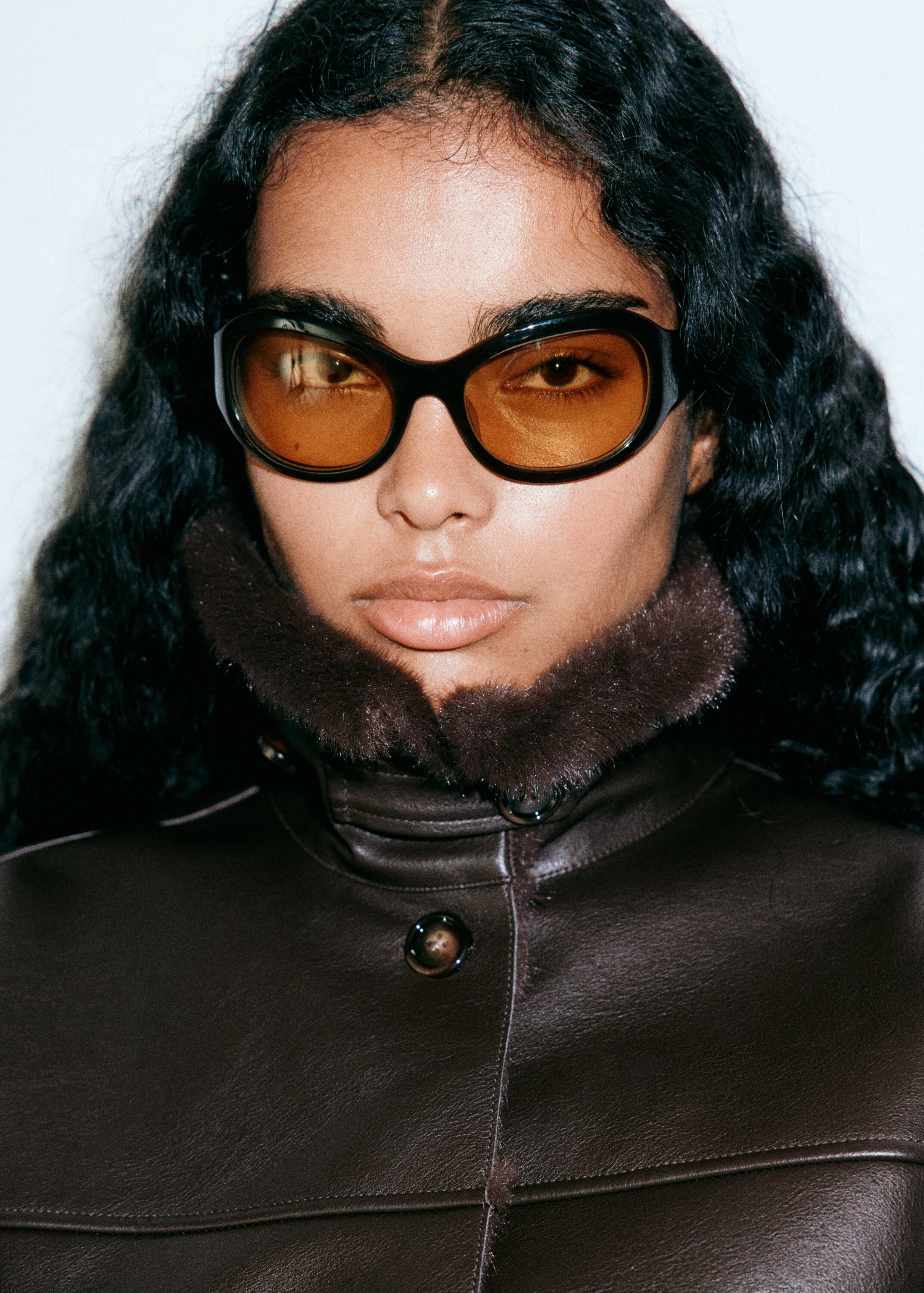Faux leather jacket with fur trim
