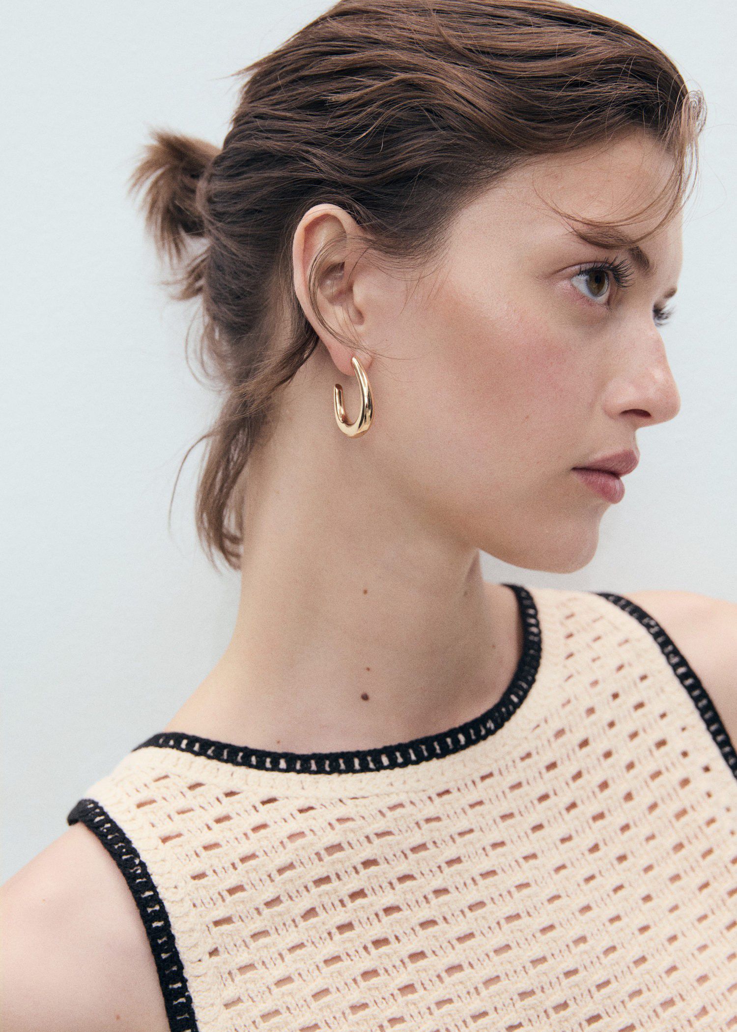 Crochet top with floral finishes