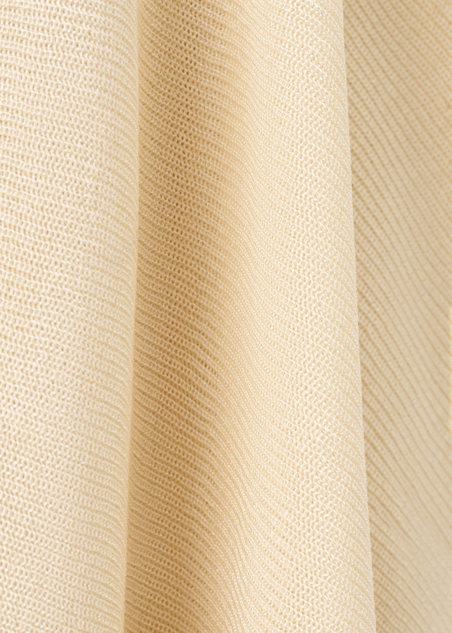 Asymmetrical knitted cape