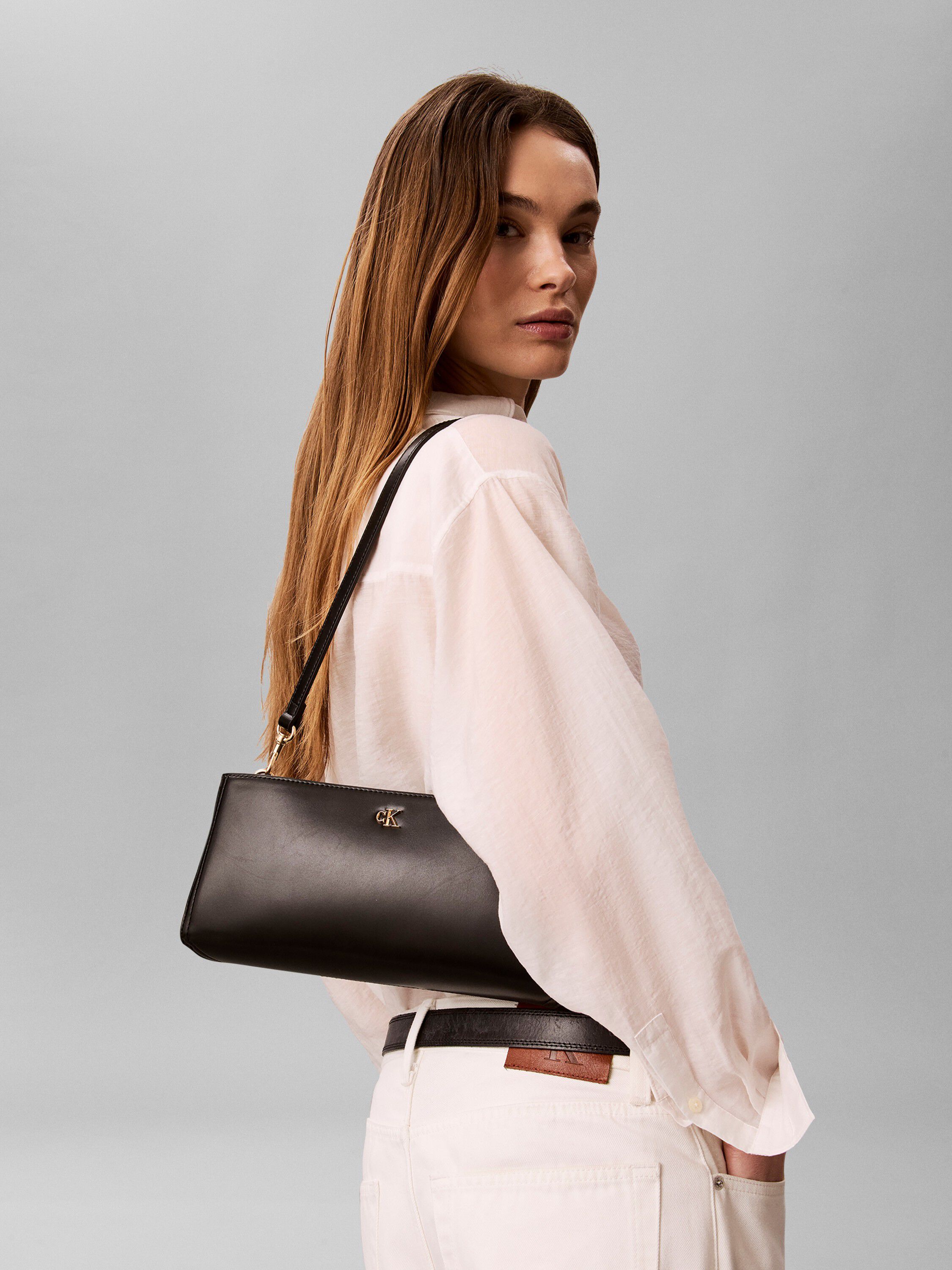 CK ELONGATED SHOULDER BAG