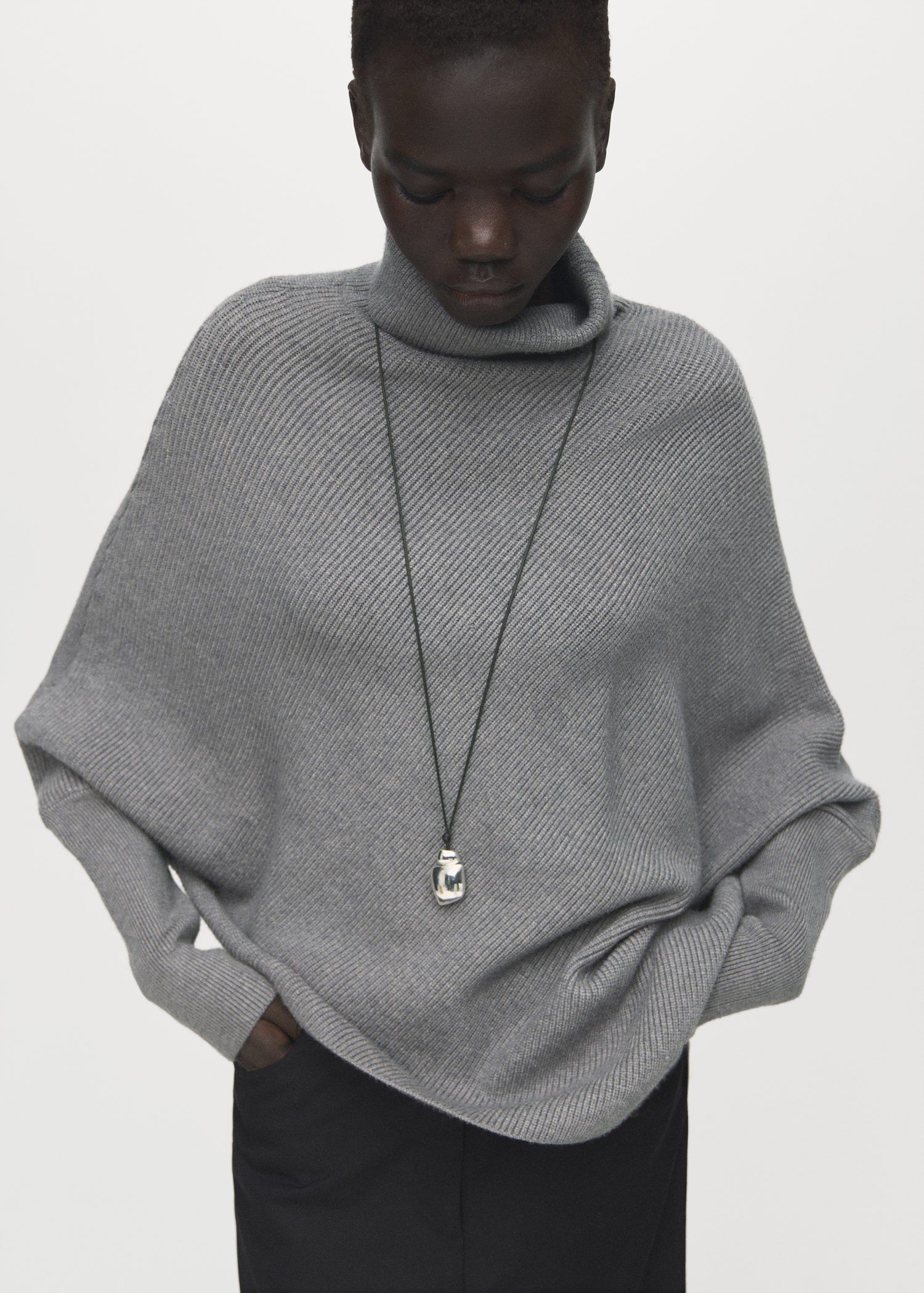 Sweater with asymmetrical roll neck