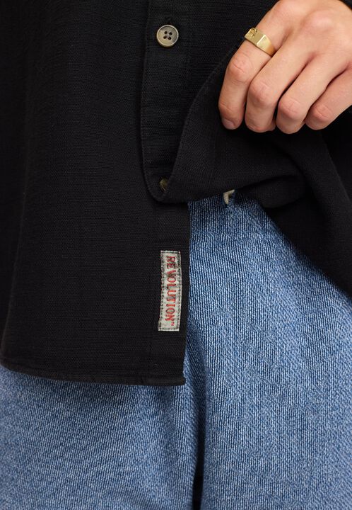 A casual overshirt in a structured garment dyed cotton fabri