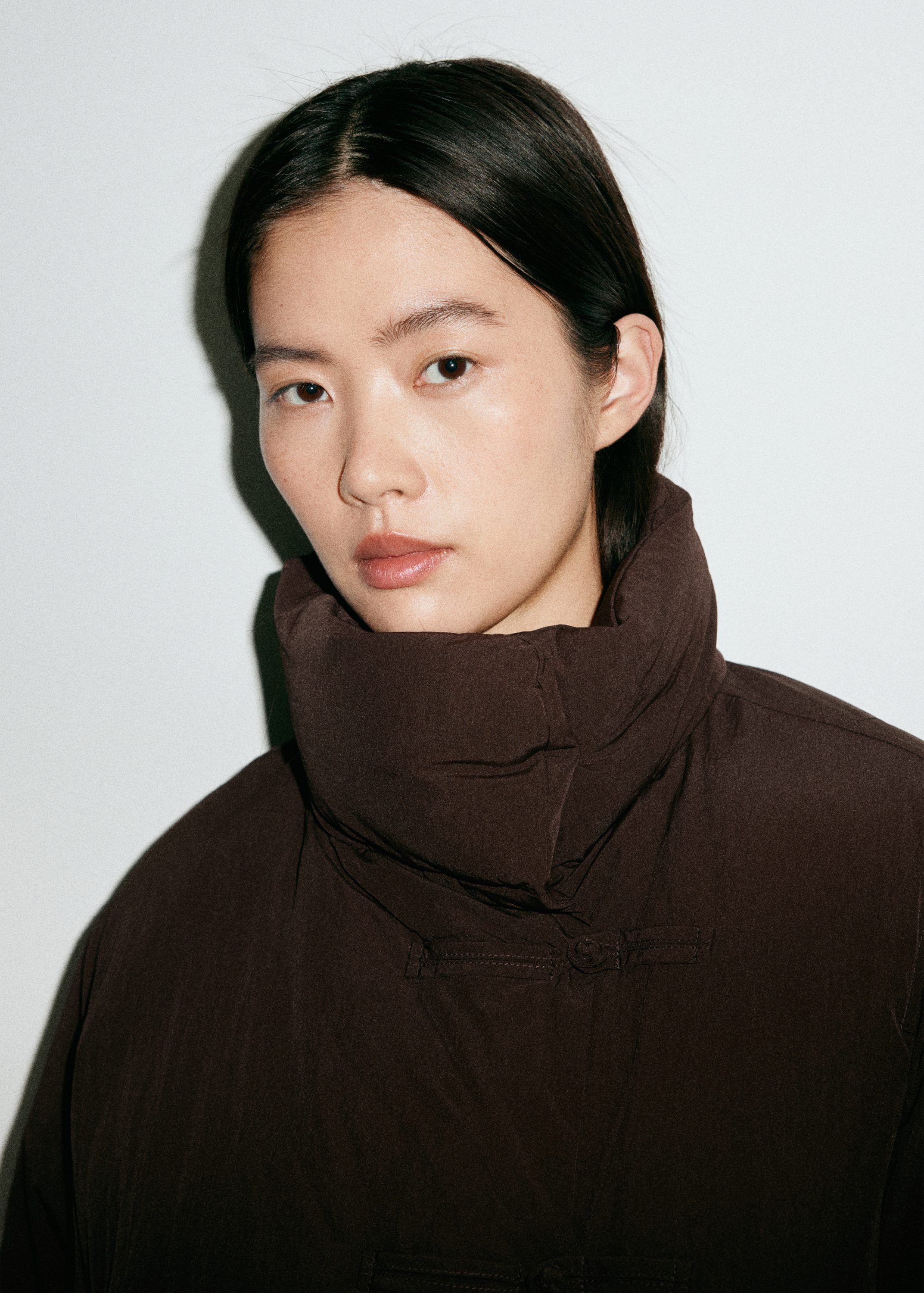 Padded anorak with toggle fastening