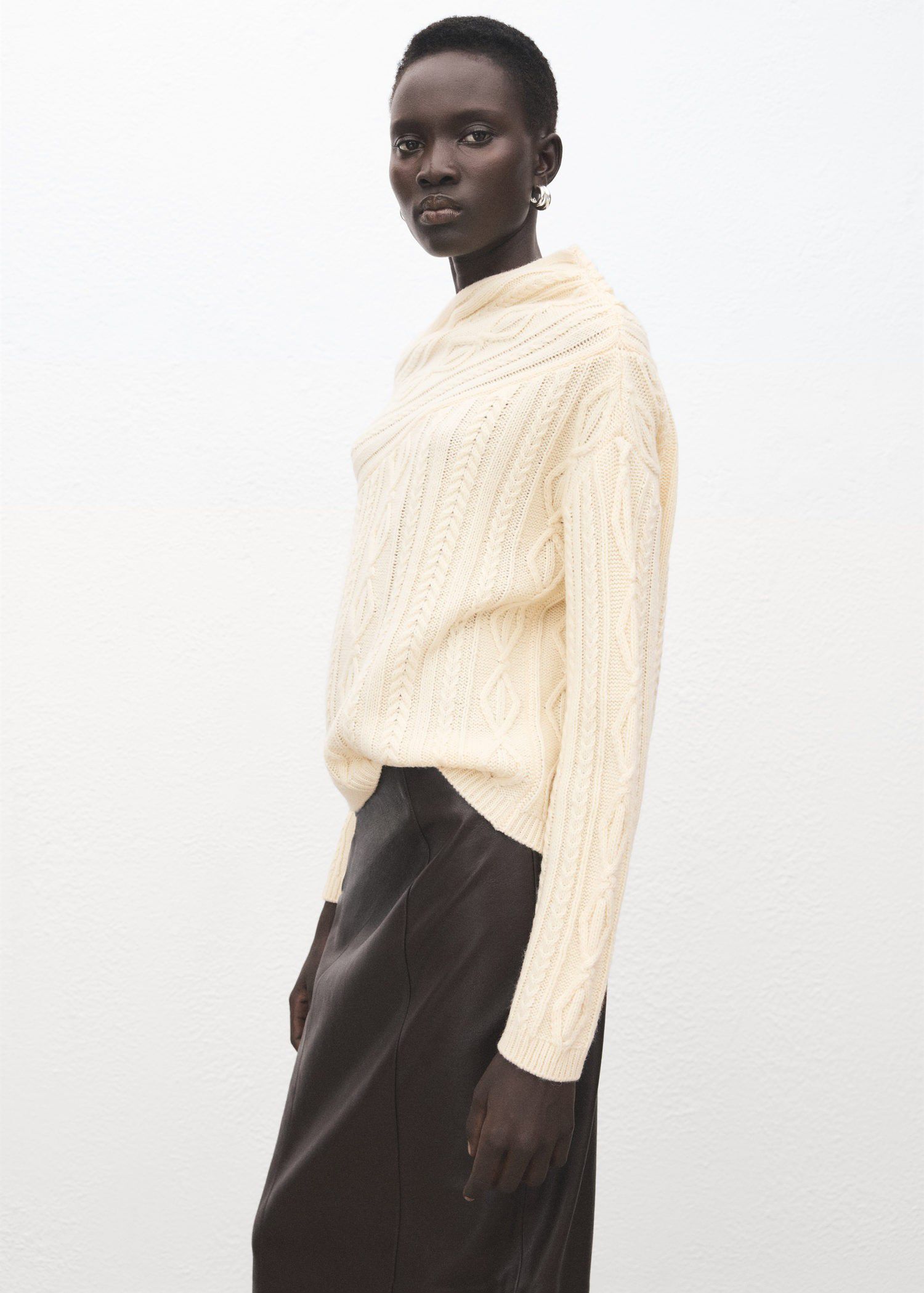Asymmetrical cable knit sweater