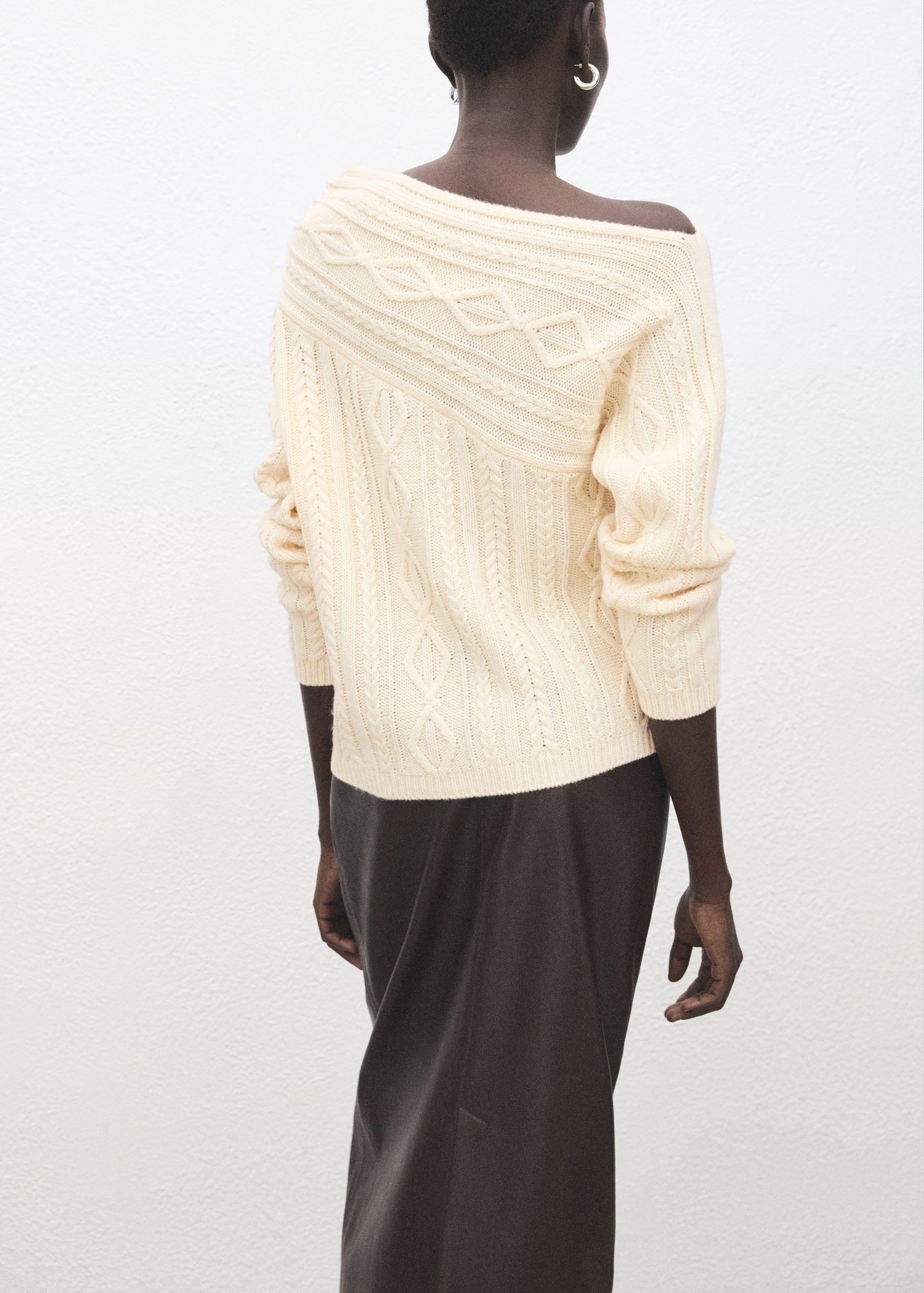 Asymmetrical cable knit sweater