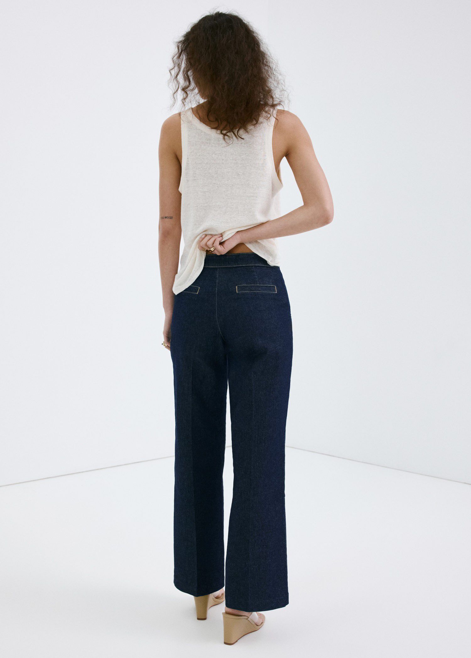 Wide-leg jeans with side buttons