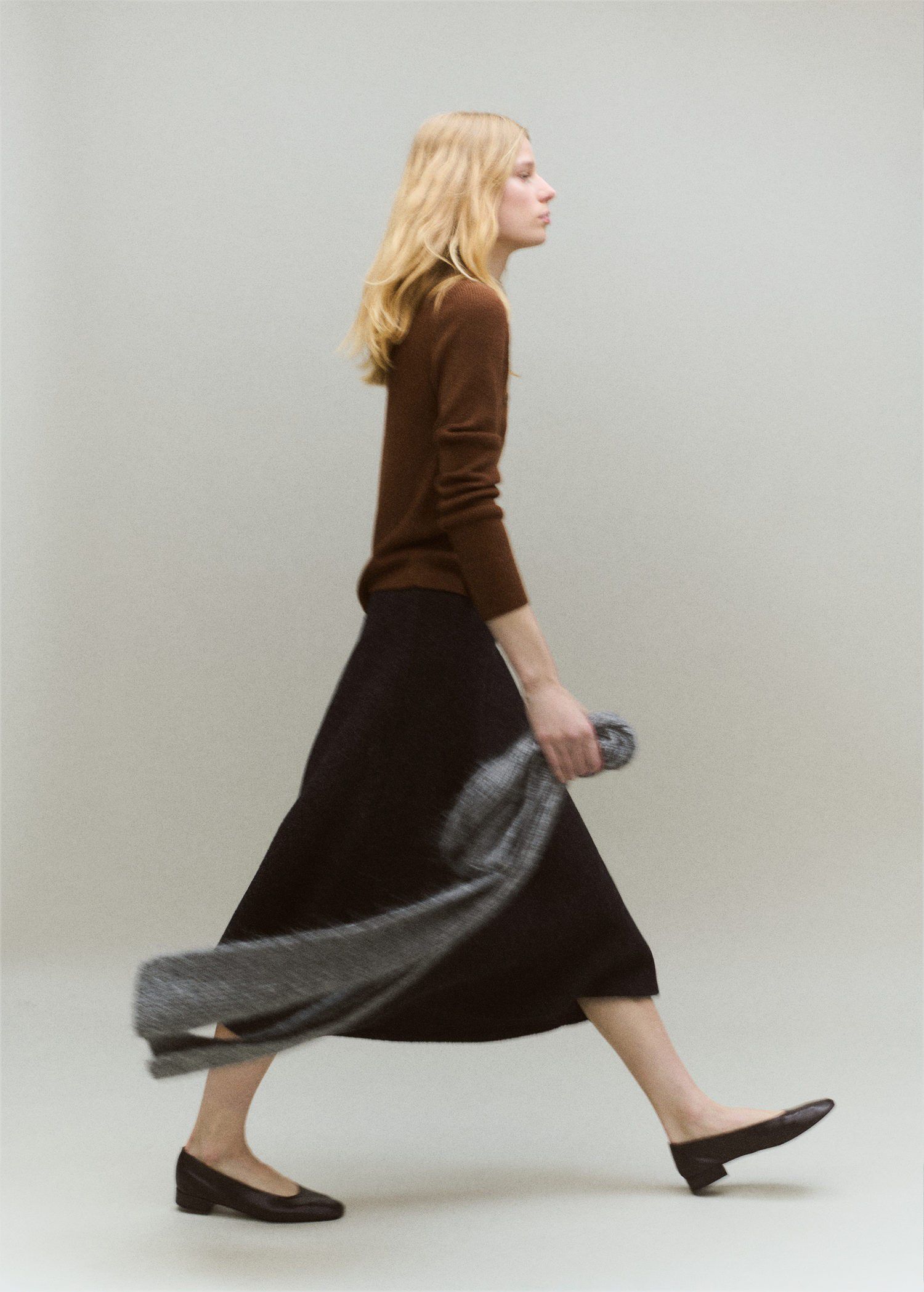 Sweater with asymmetrical neck and