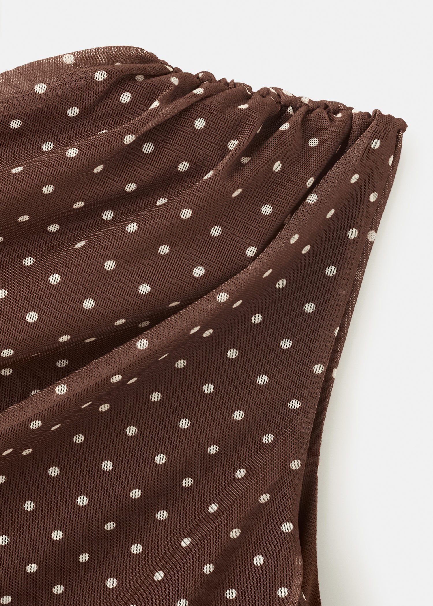 Asymmetric polka dot top