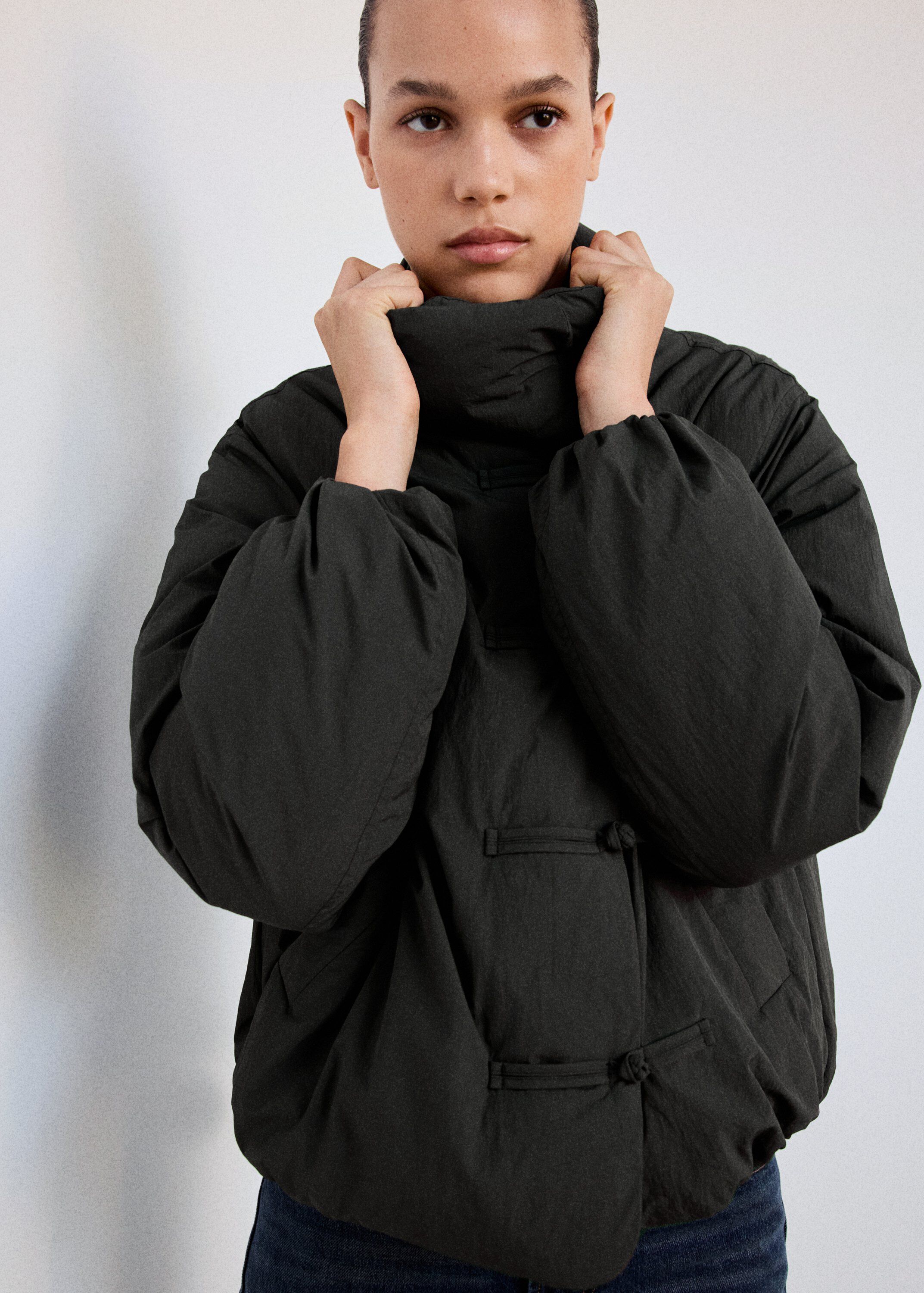 Padded anorak with toggle fastening