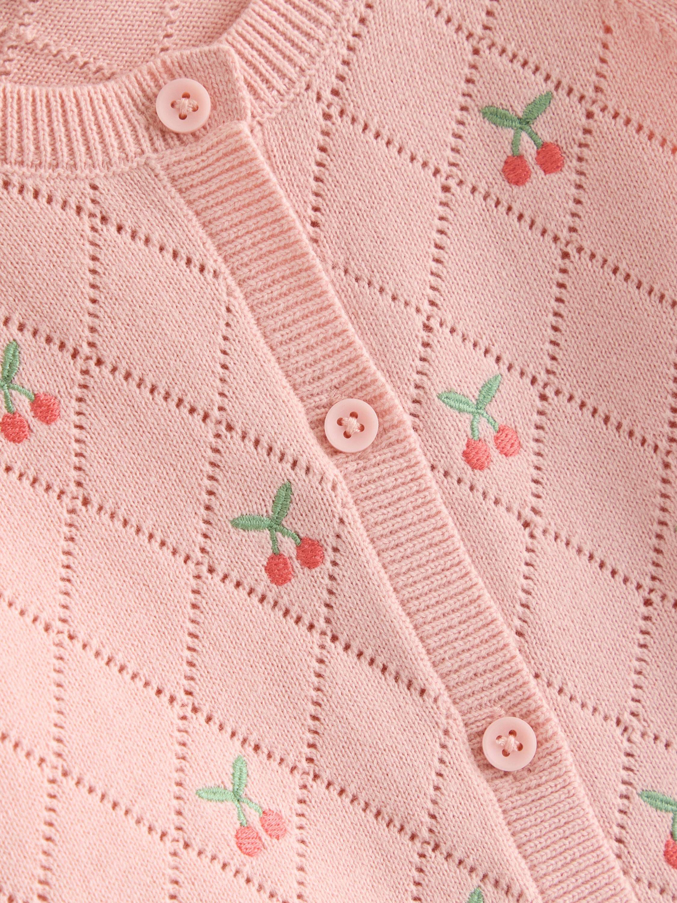 Stickad cardigan med broderade deta