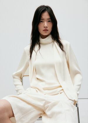 High-neck blouse with scarf detail