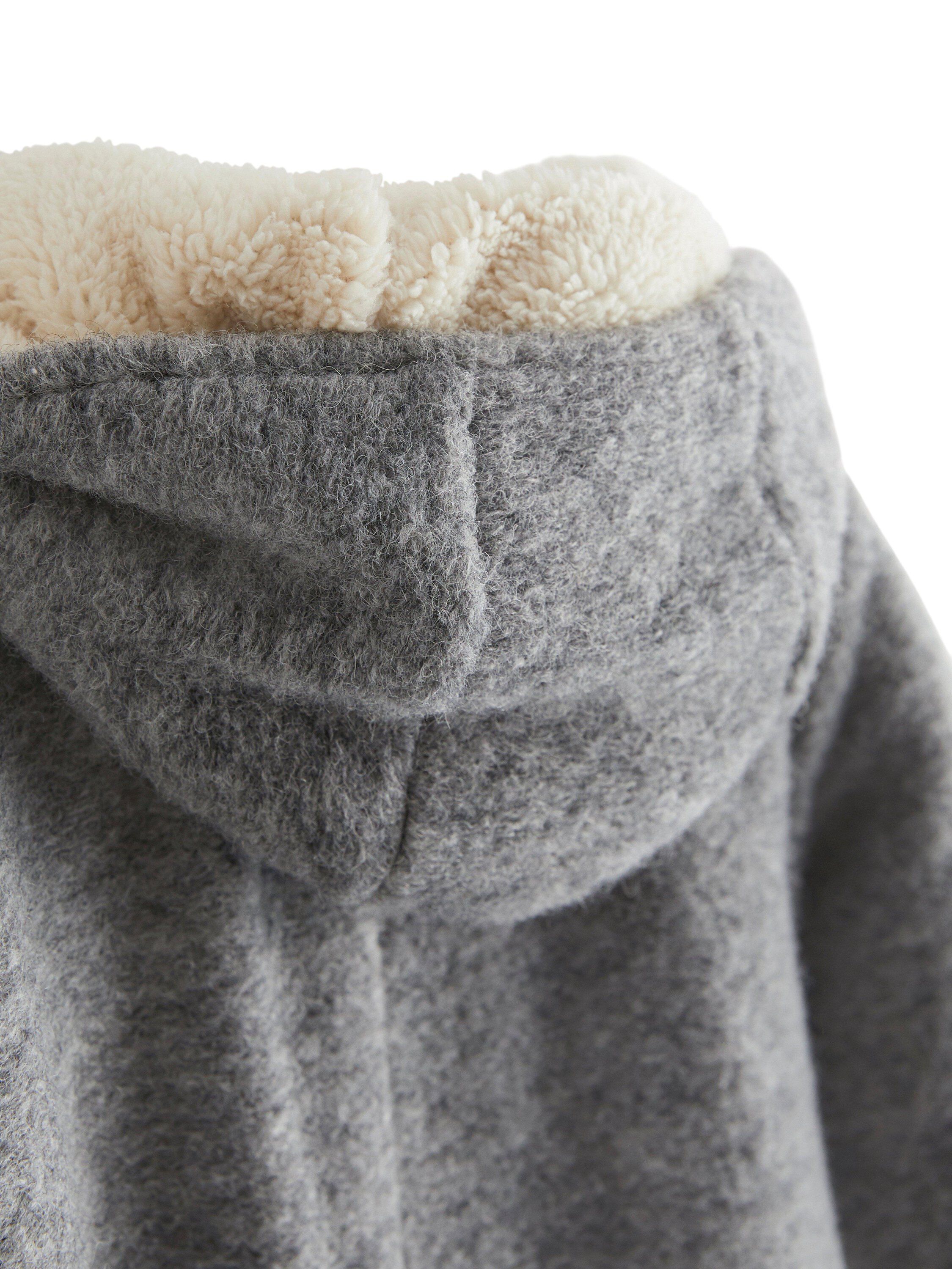 A cosy overall in light grey wool b