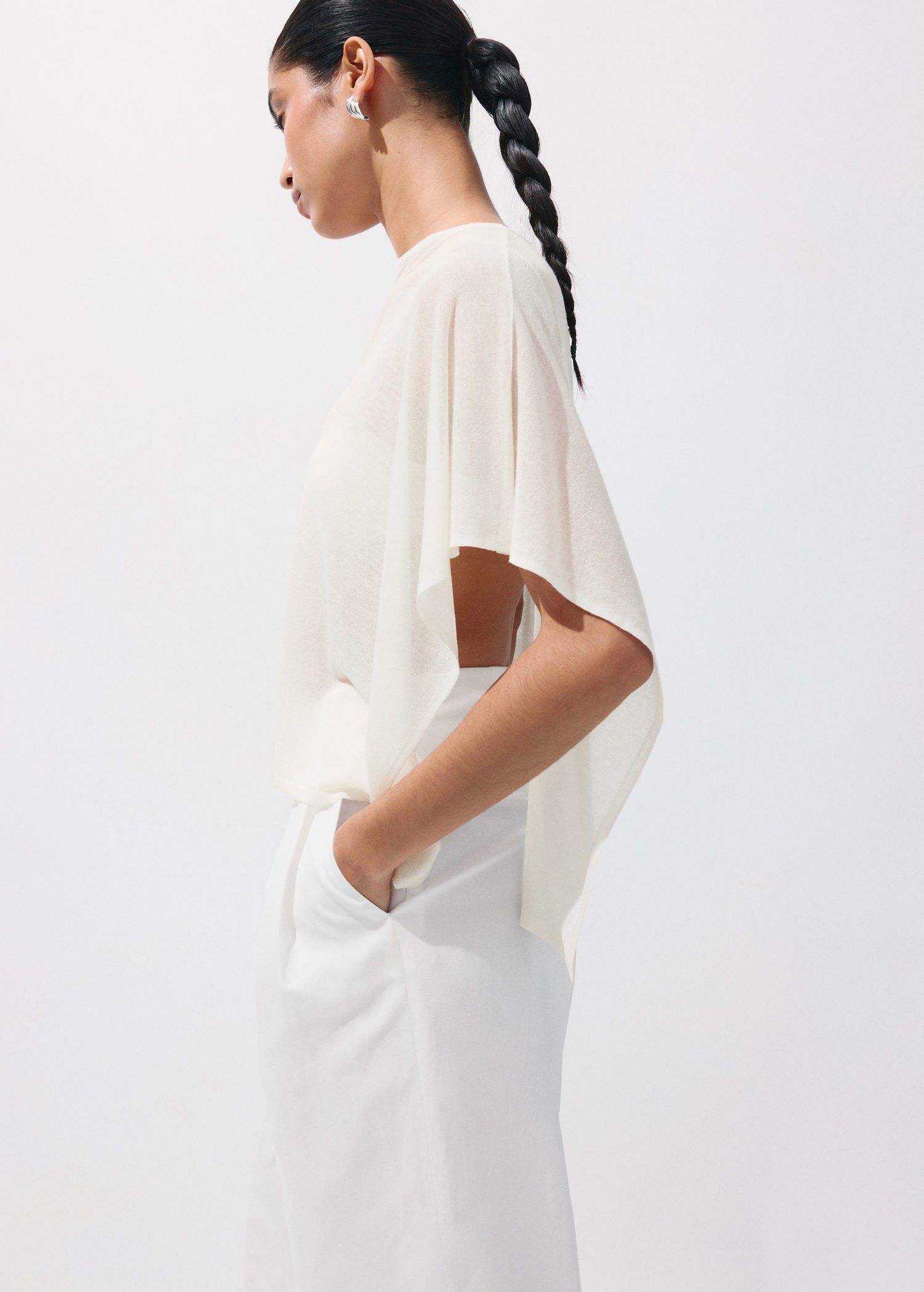 Asymmetrical knitted cape