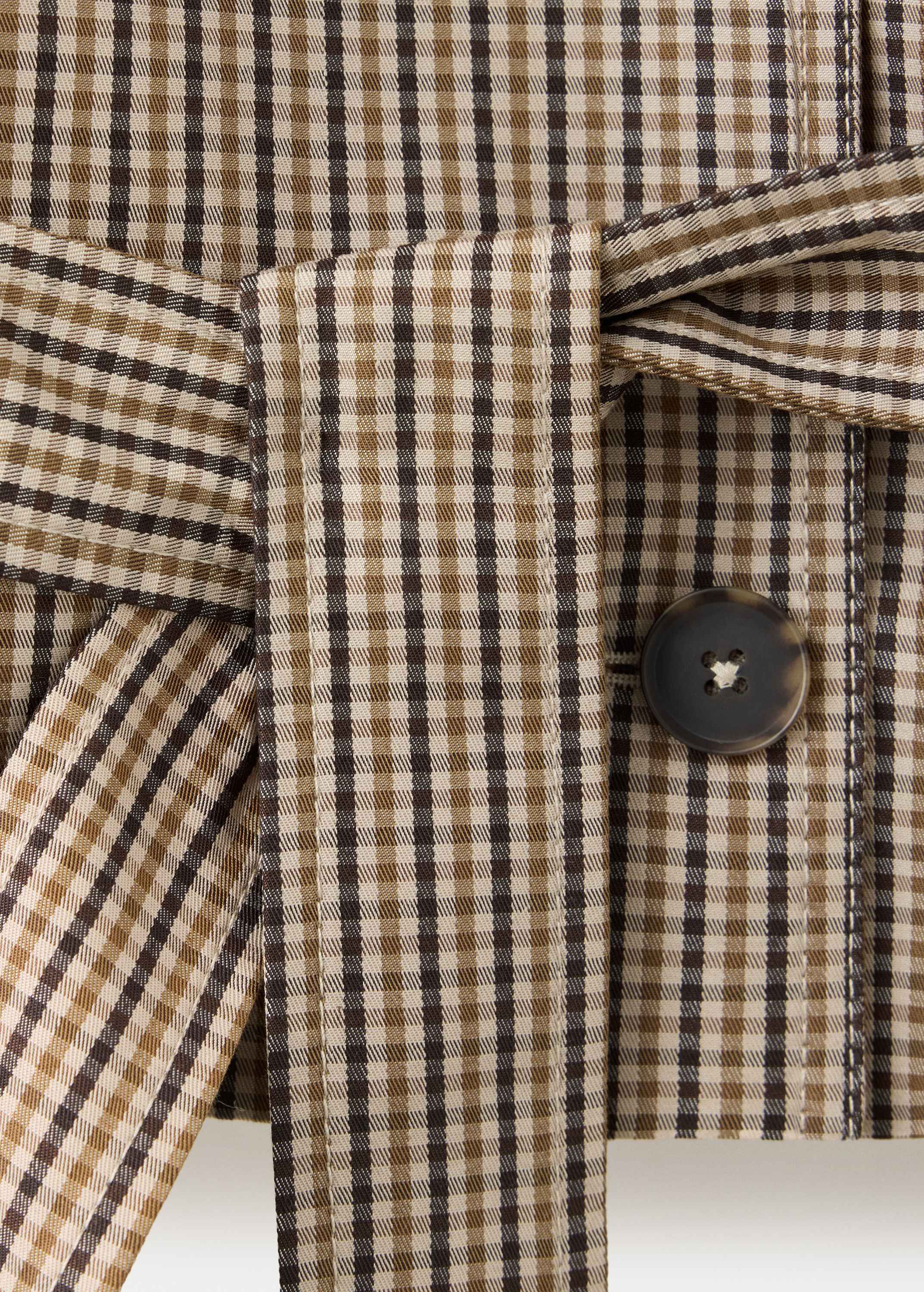Short checked trench coat with belt