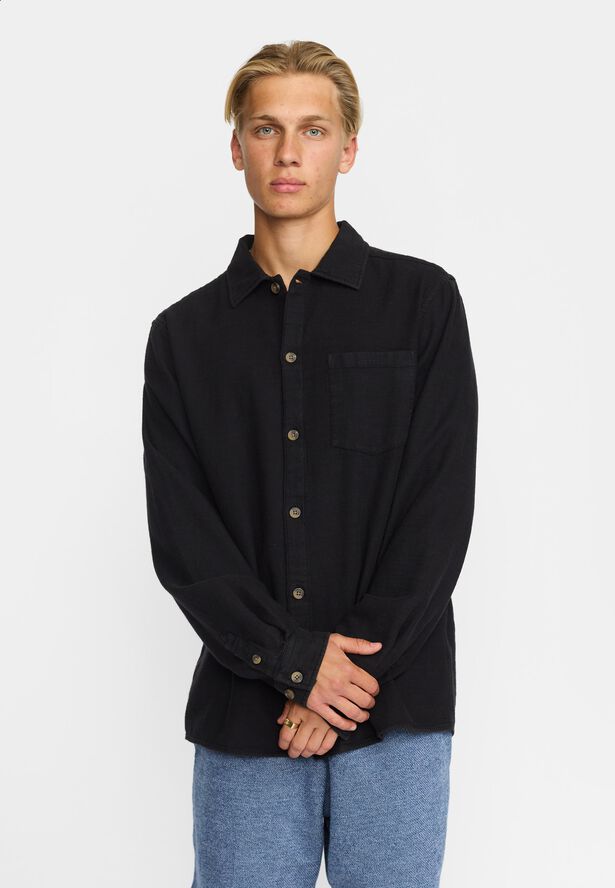 A casual overshirt in a structured garment dyed cotton fabri