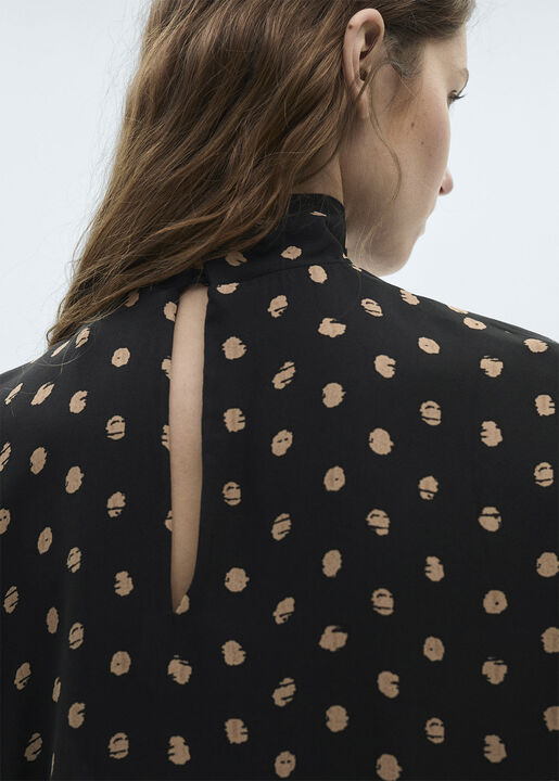 Polka dot blouse with draped collar