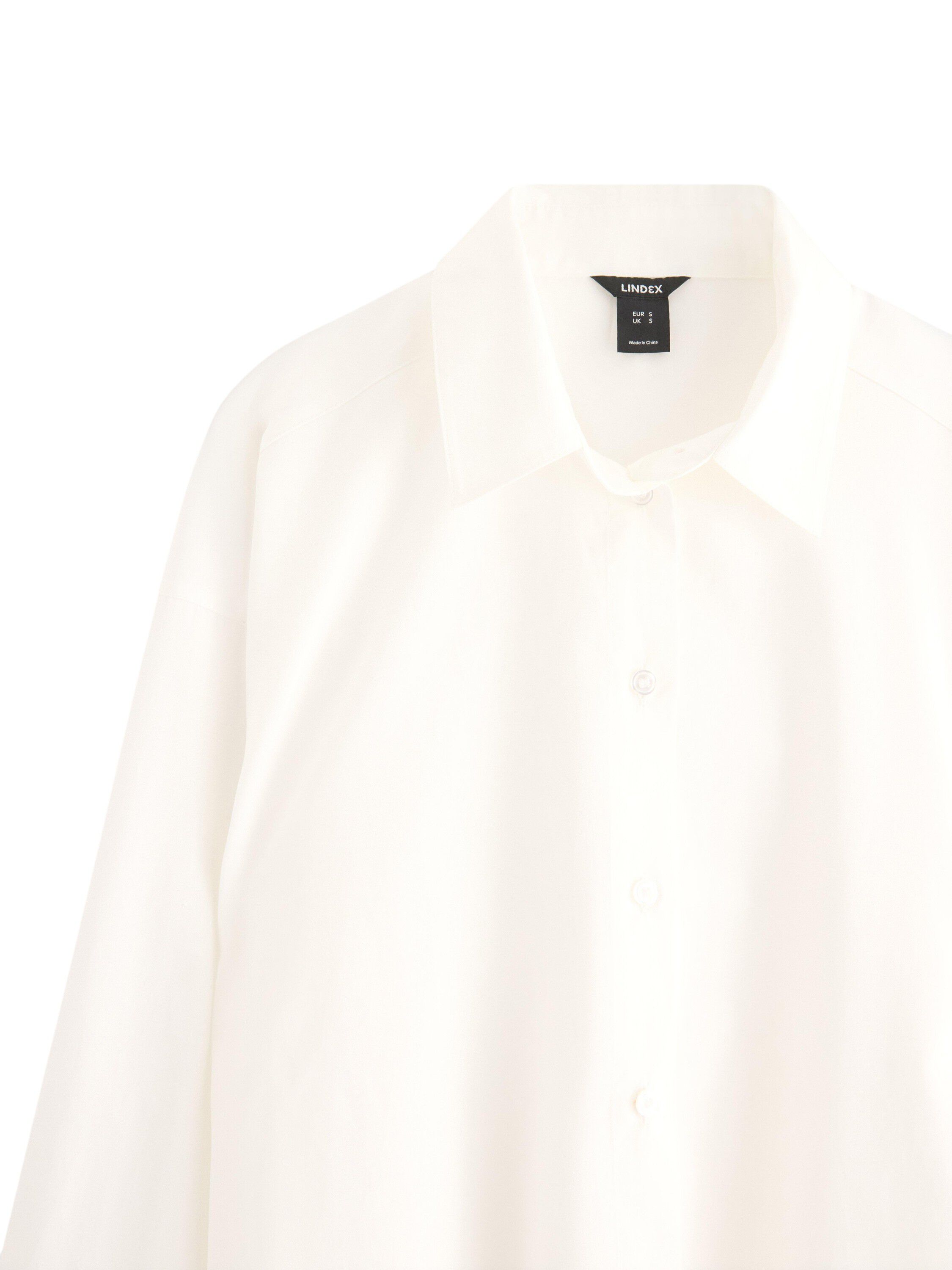 Lang&aelig;rmet skjorte i v&aelig;vet materia