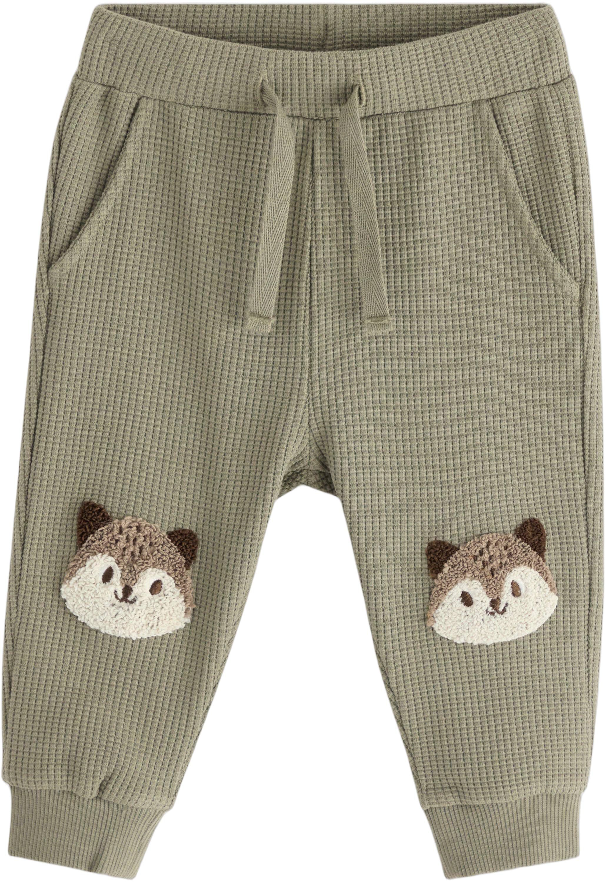 Joggers in waffled cotton with appl