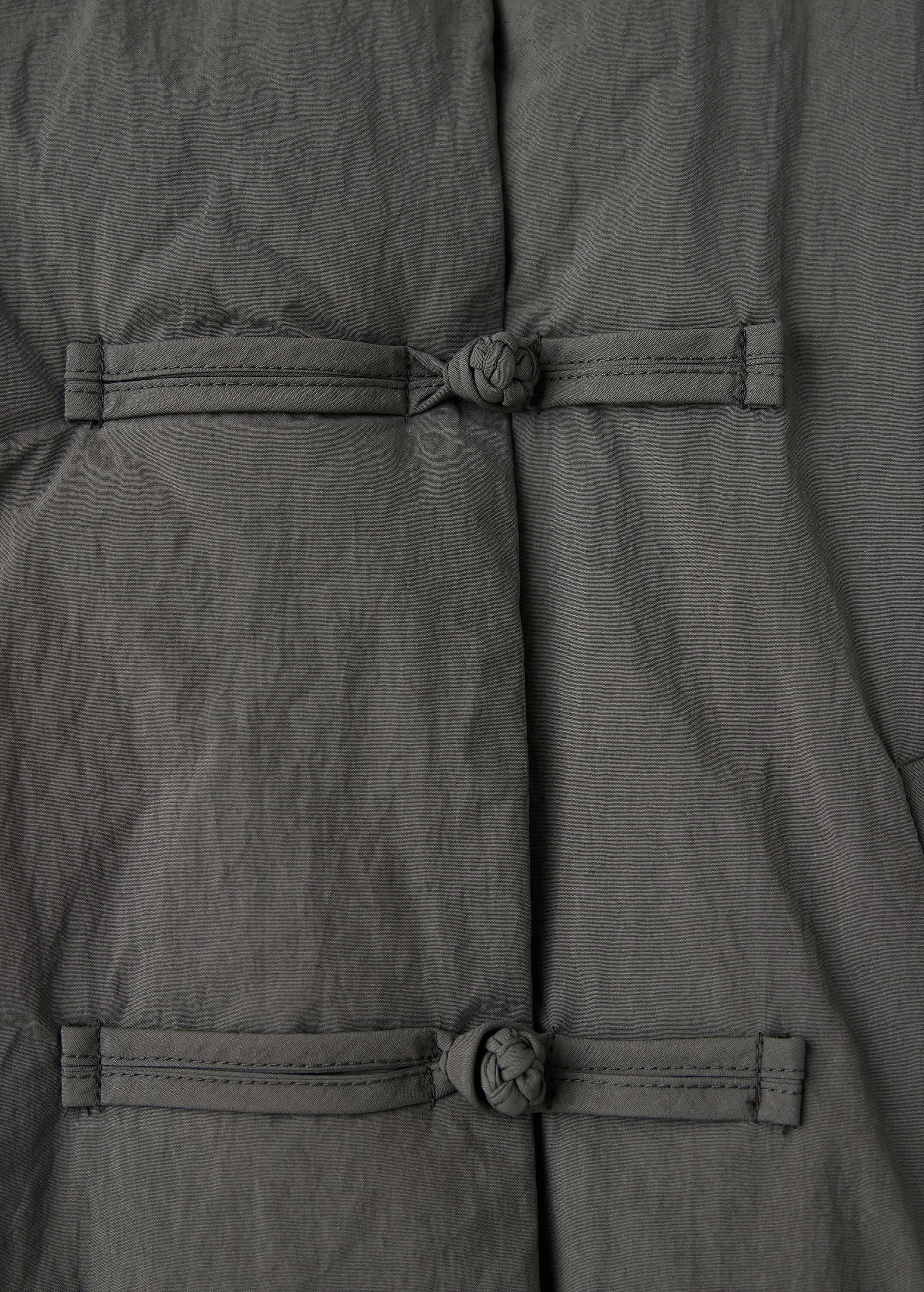 Padded anorak with toggle fastening