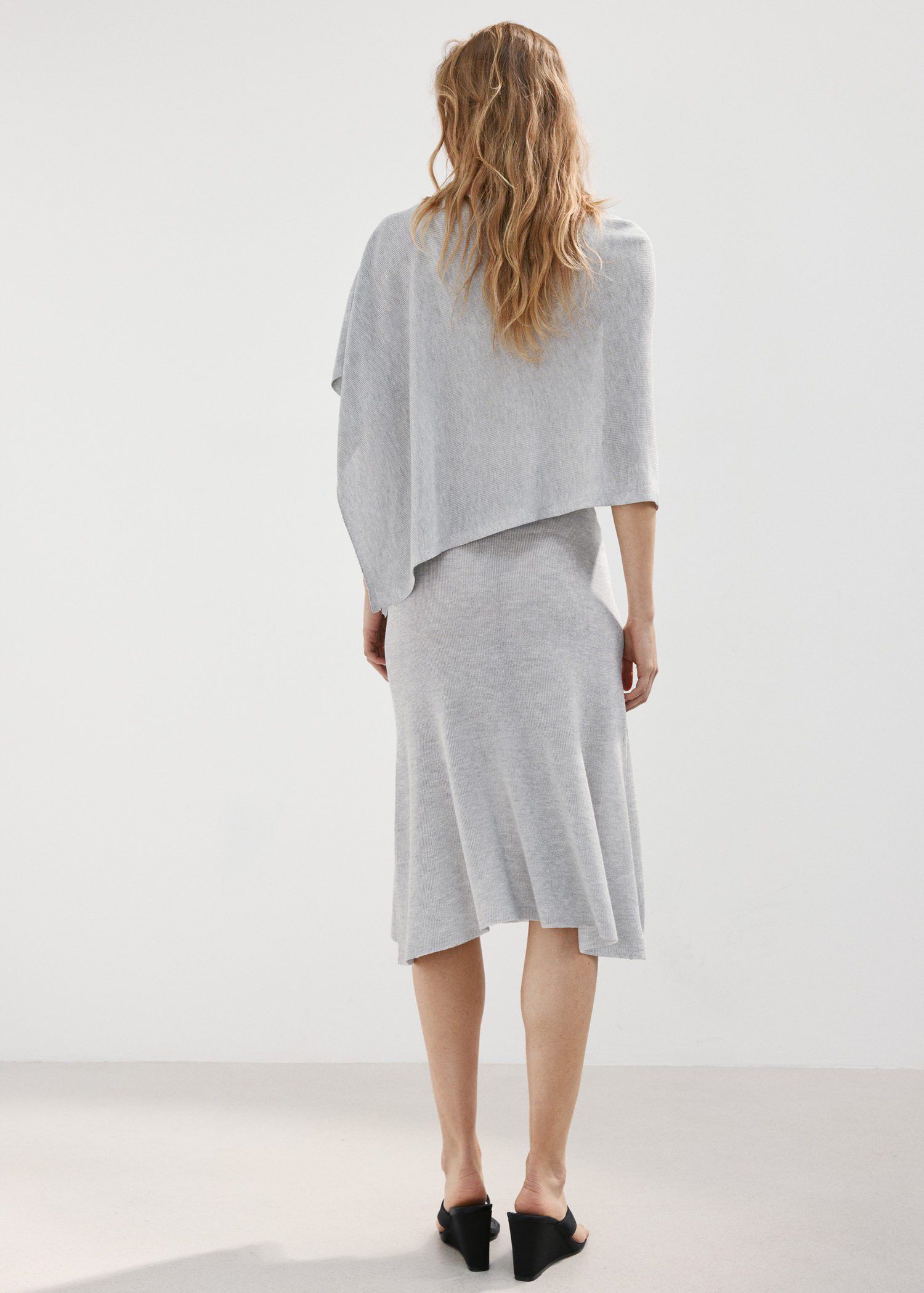 Asymmetrical knitted cape