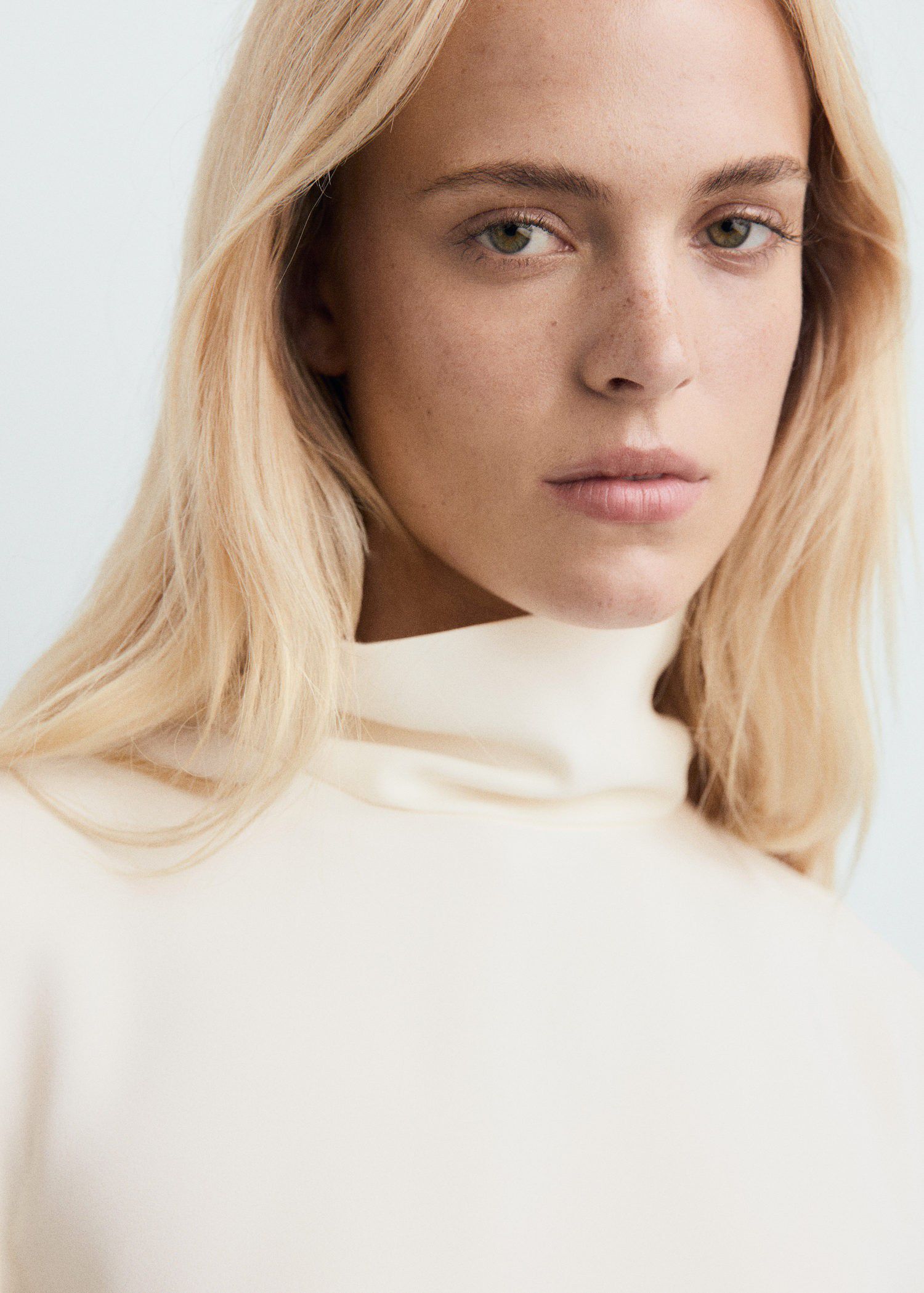 High-neck blouse with asymmetrical