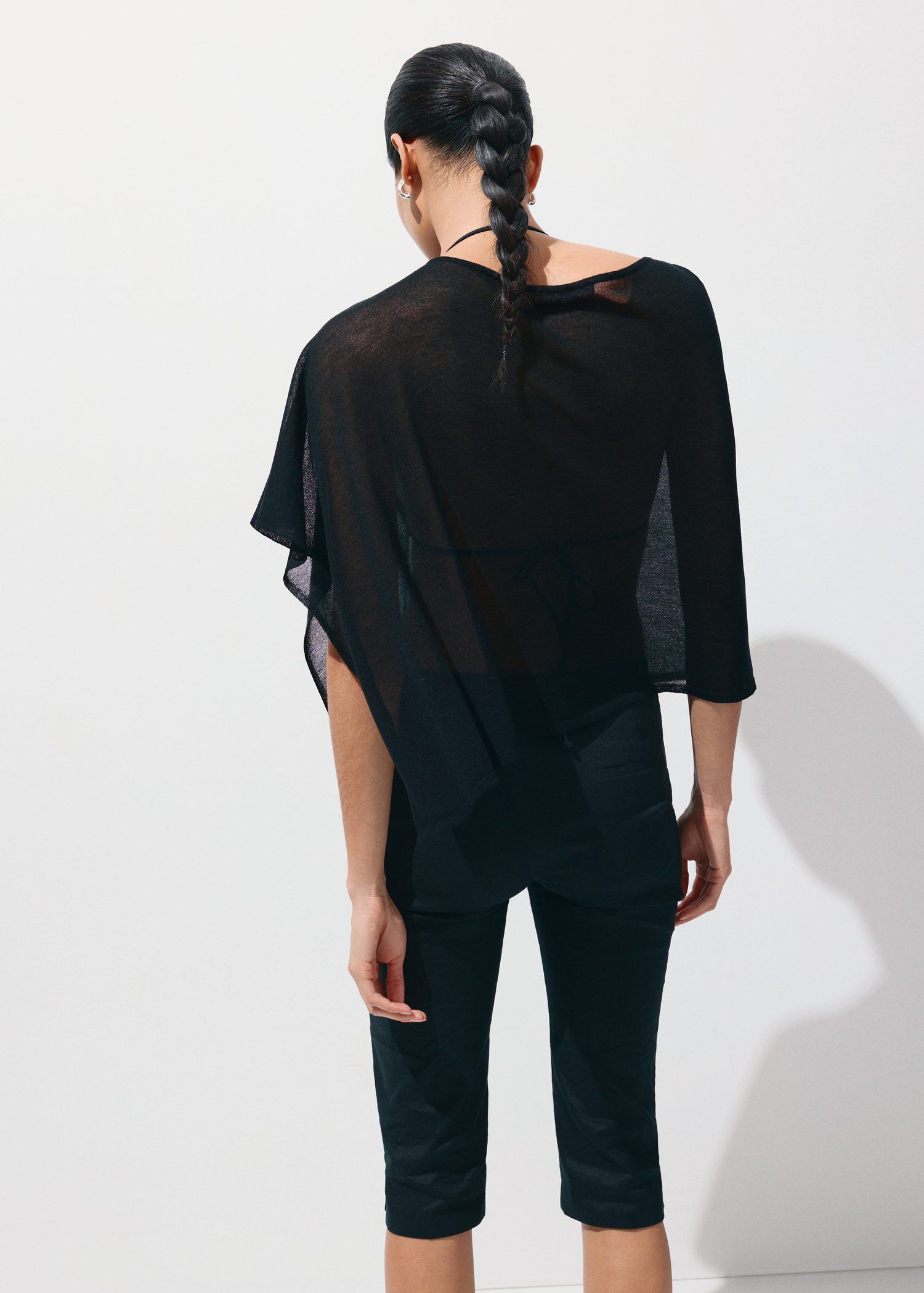 Asymmetrical knitted cape