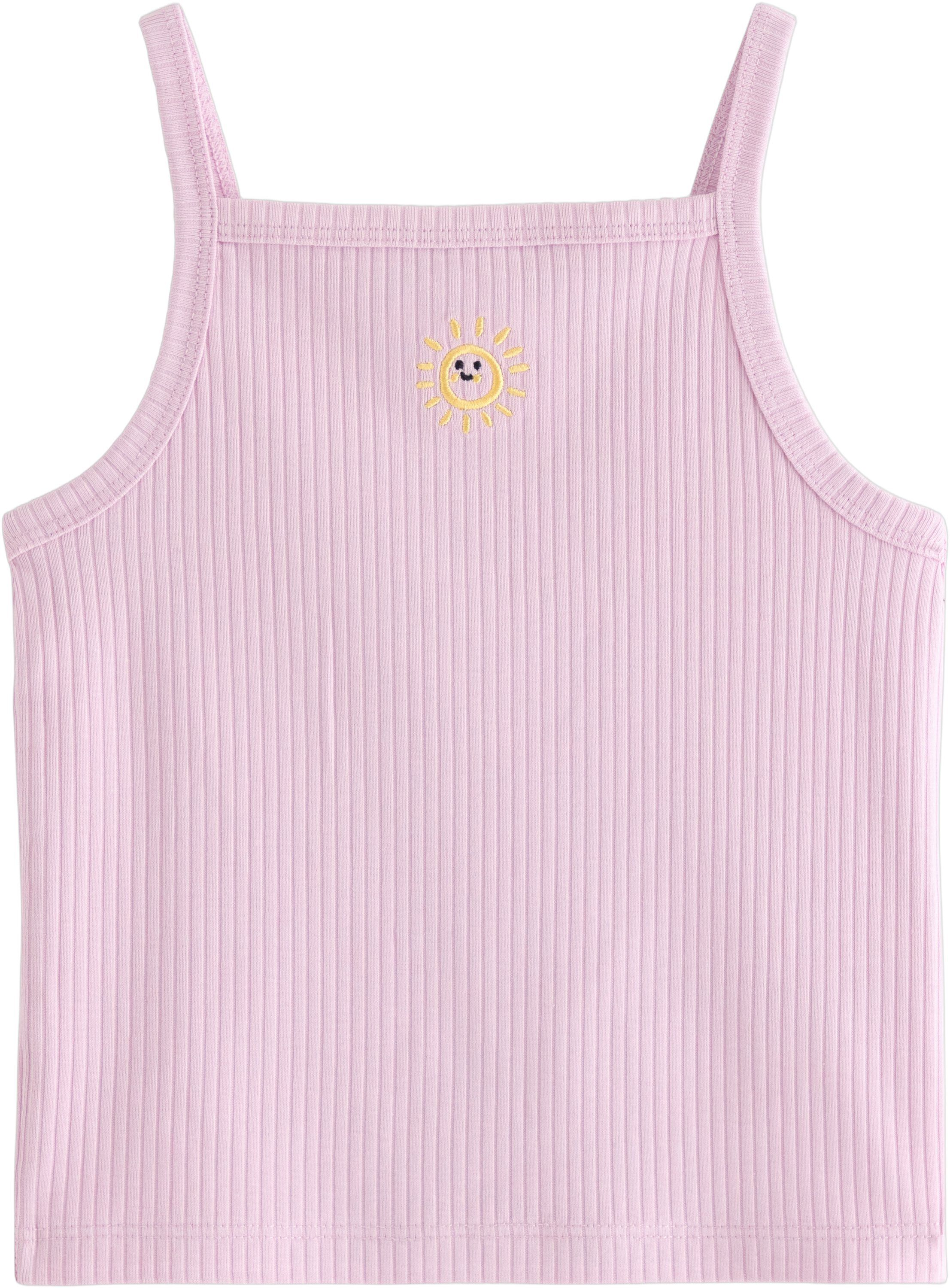 Ribbet singlet med et lite broderi