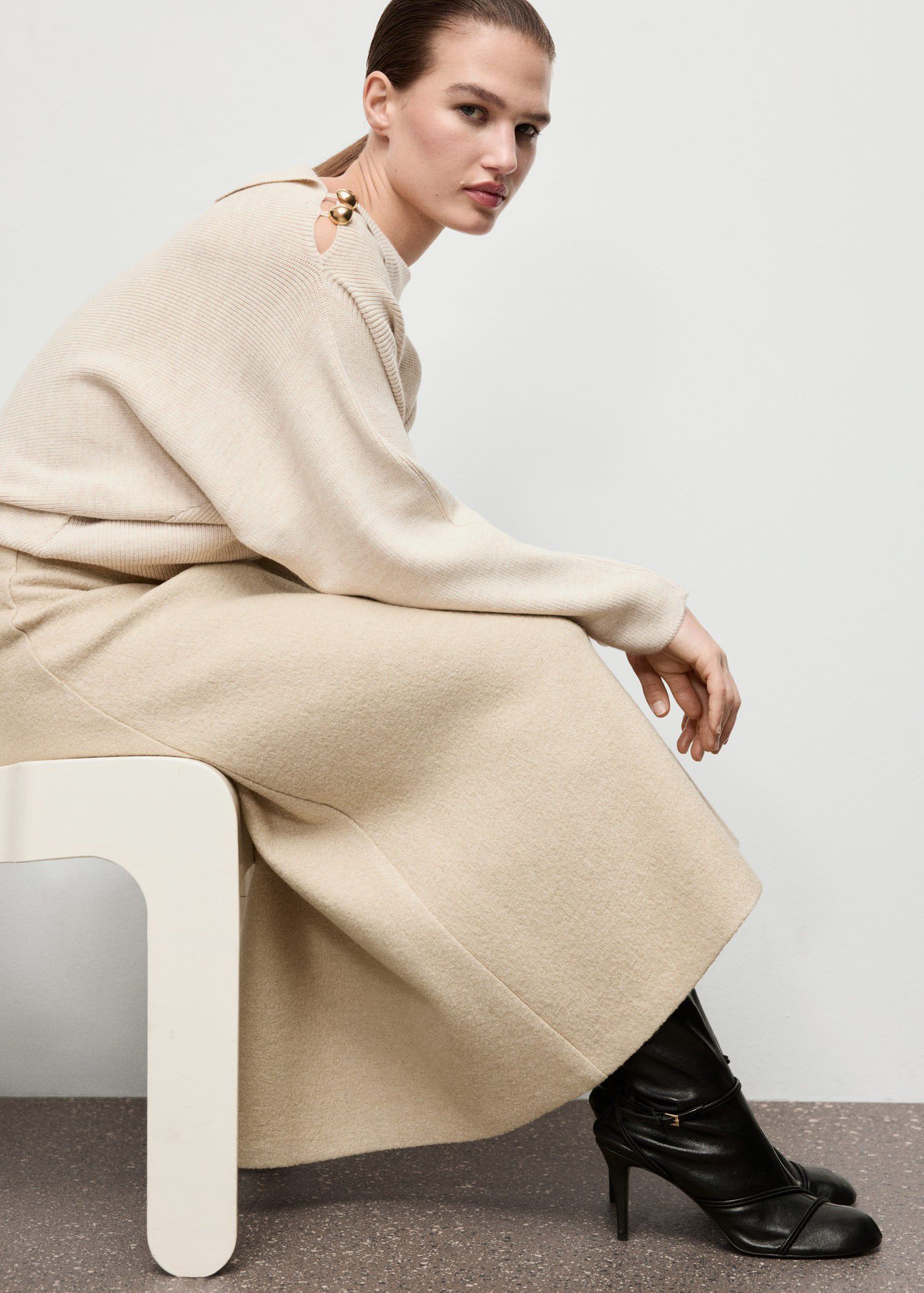 Sweater with asymmetrical neck and