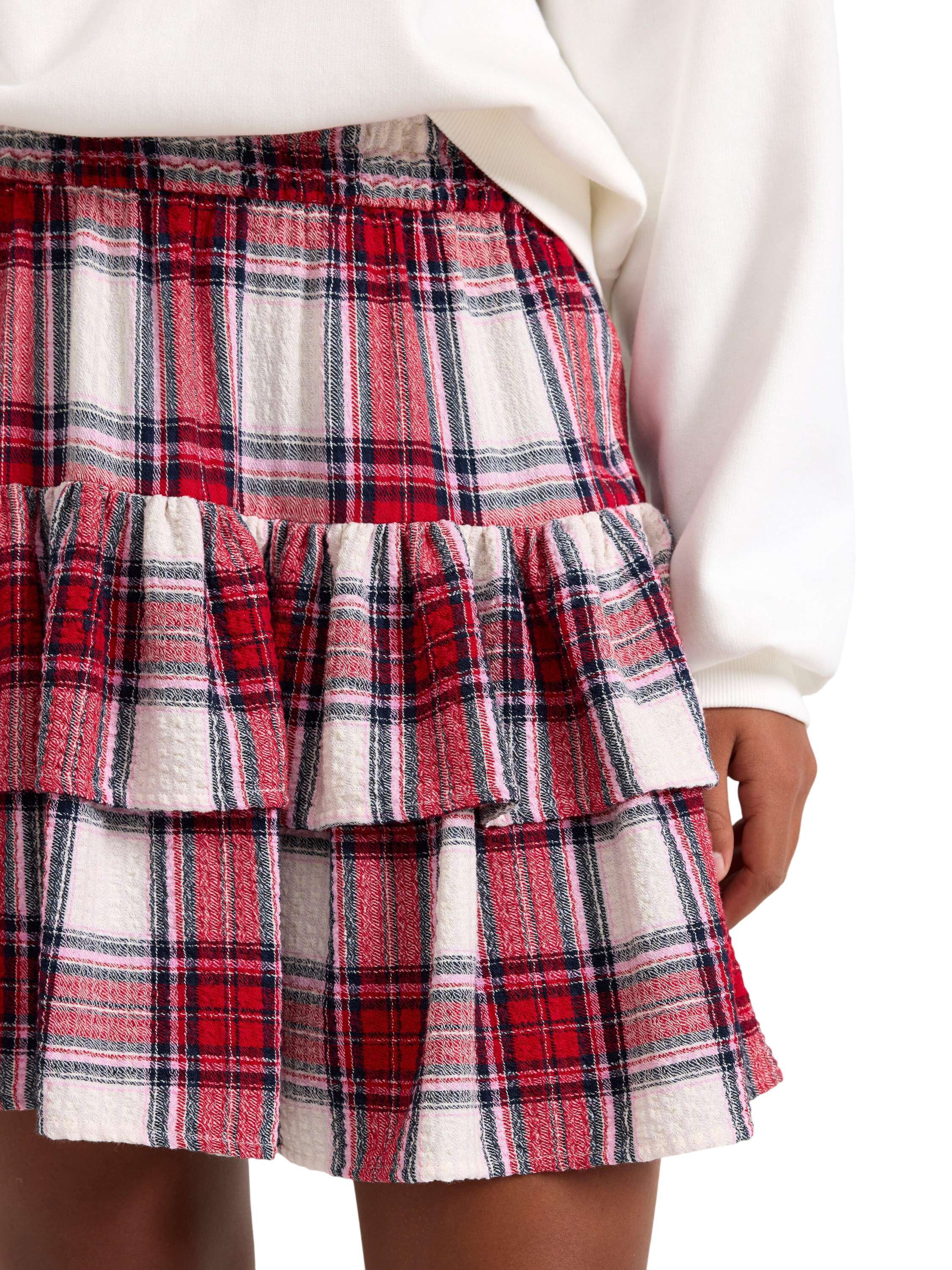 Vevd skj&oslash;rt med volanger og elastis