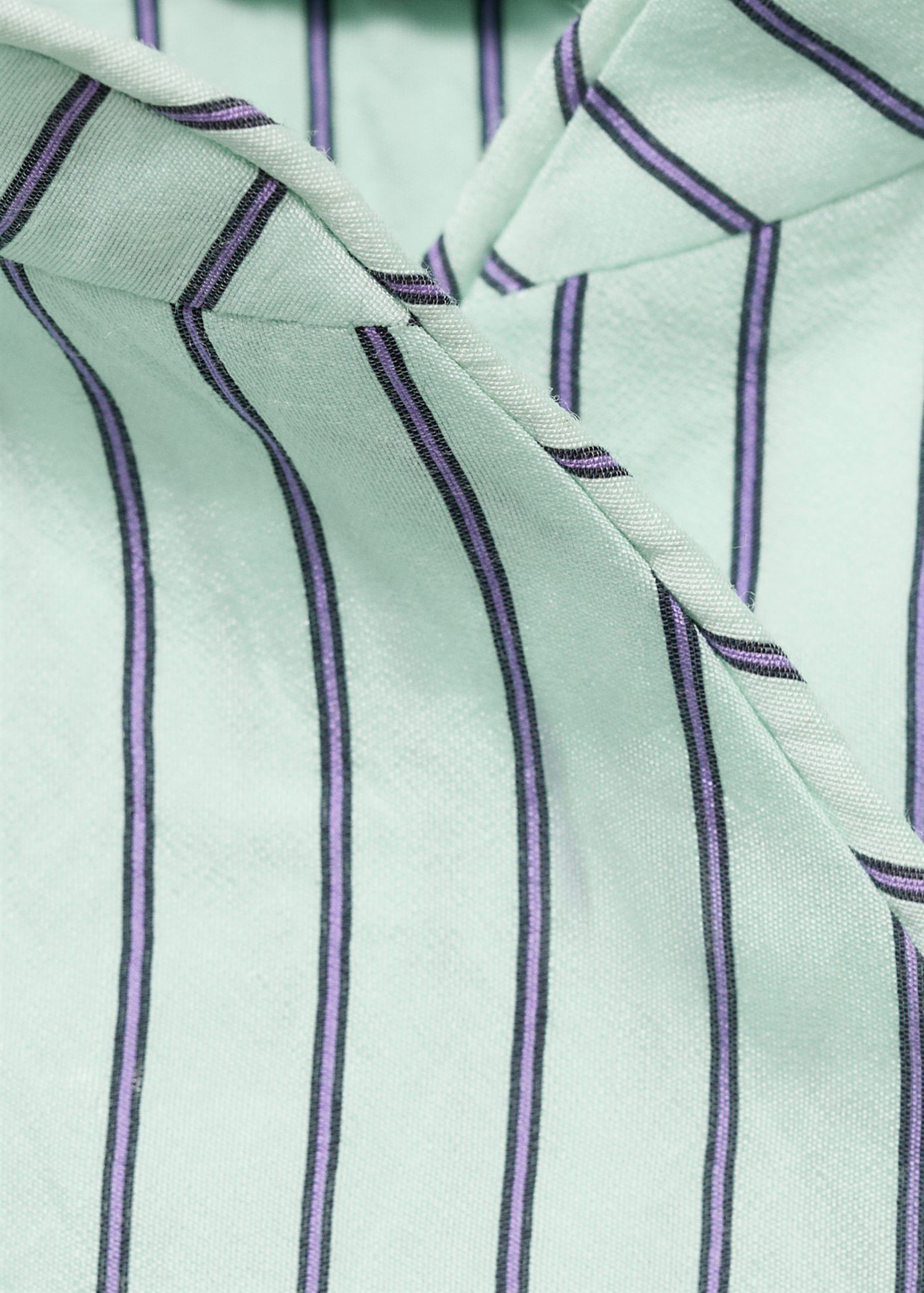 Striped top with a strap neckline a