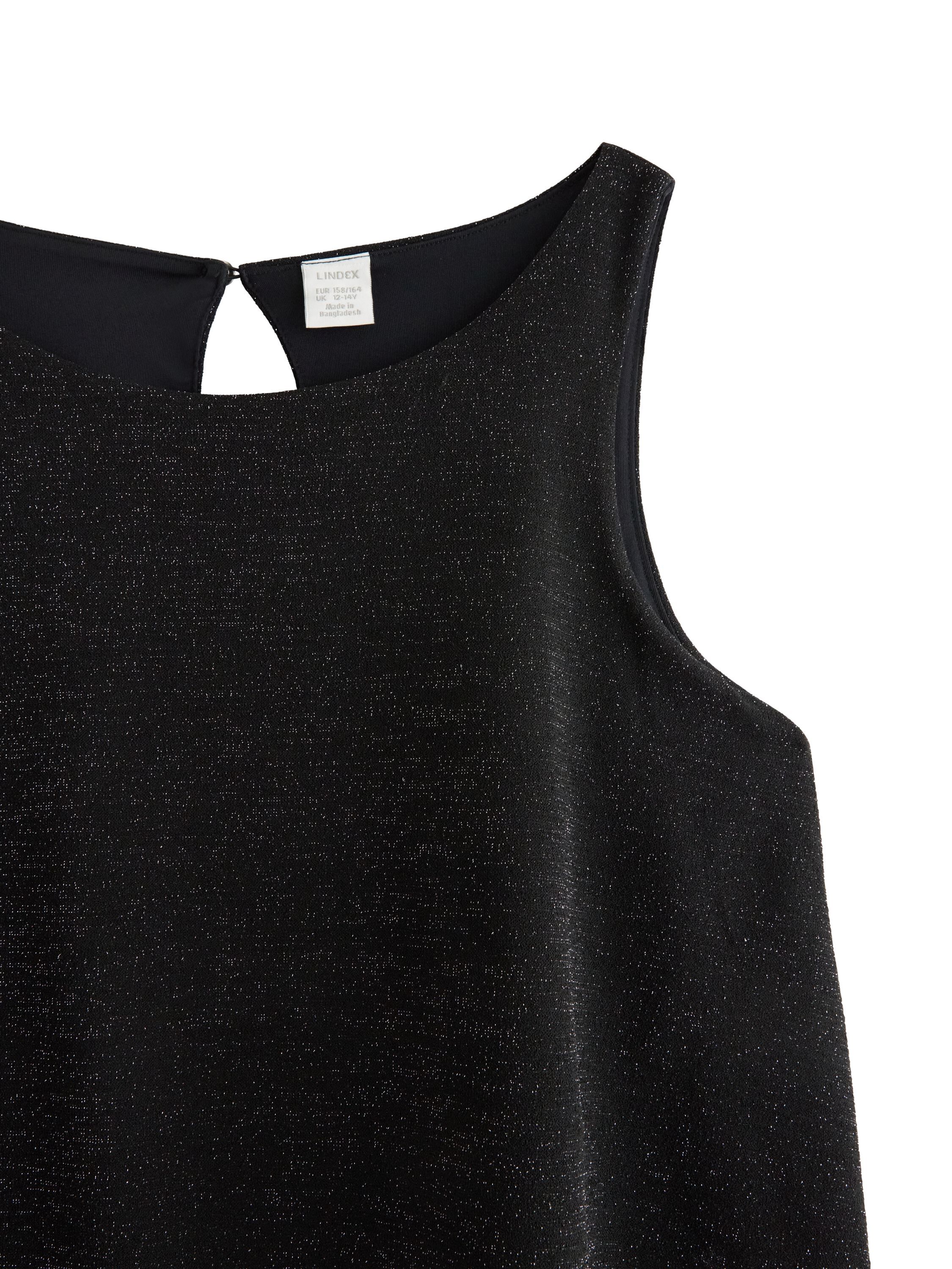 Glitrende, &aelig;rmel&oslash;s buksedragt med b