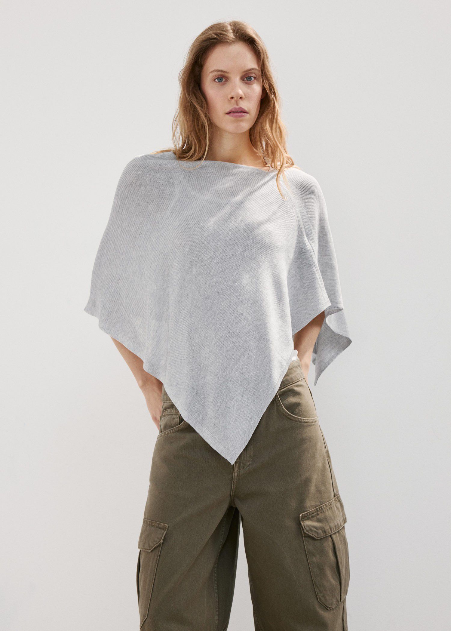Asymmetrical knitted cape
