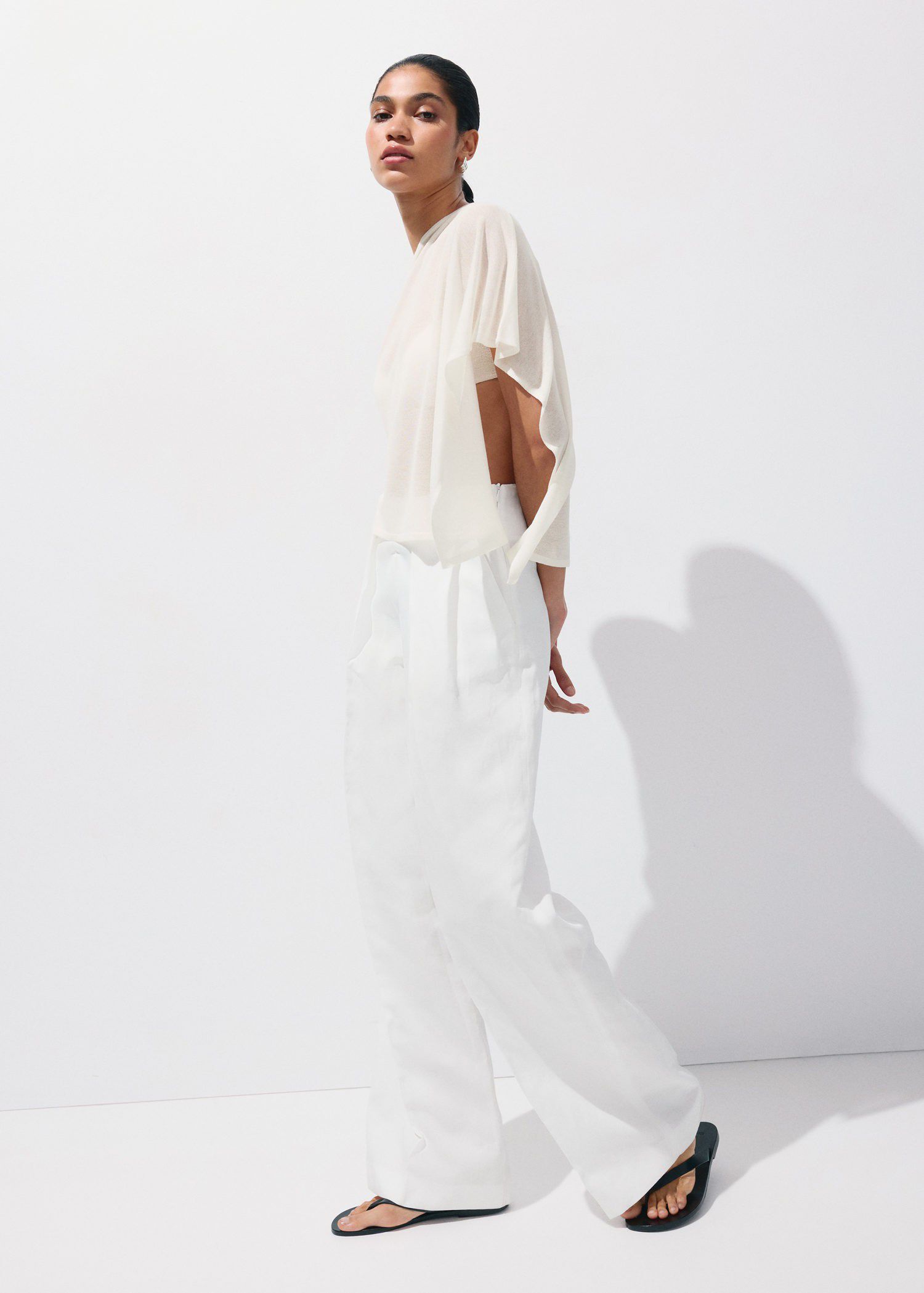 Asymmetrical knitted cape