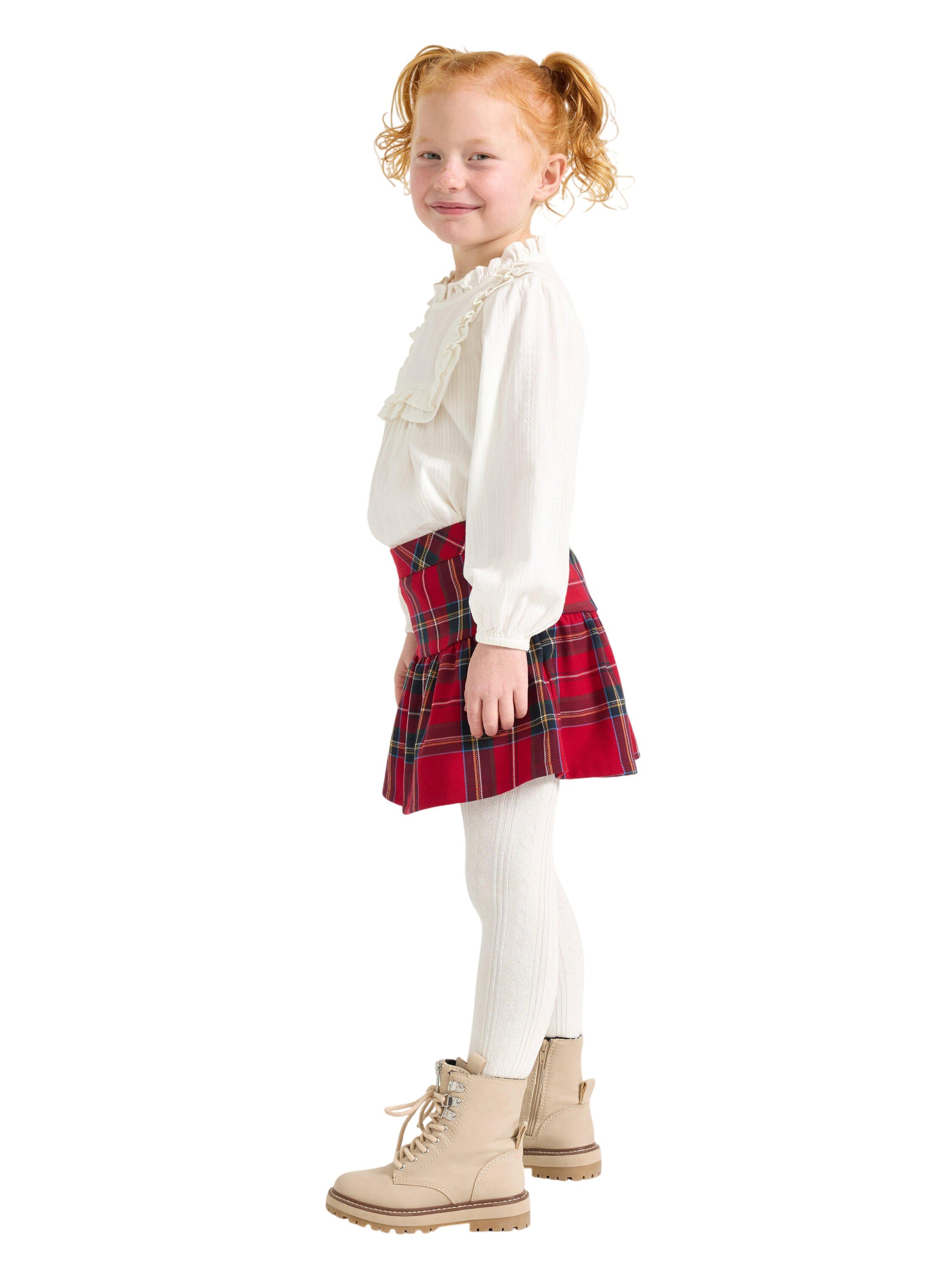 Rutig kjol med res&aring;r i midjan och d