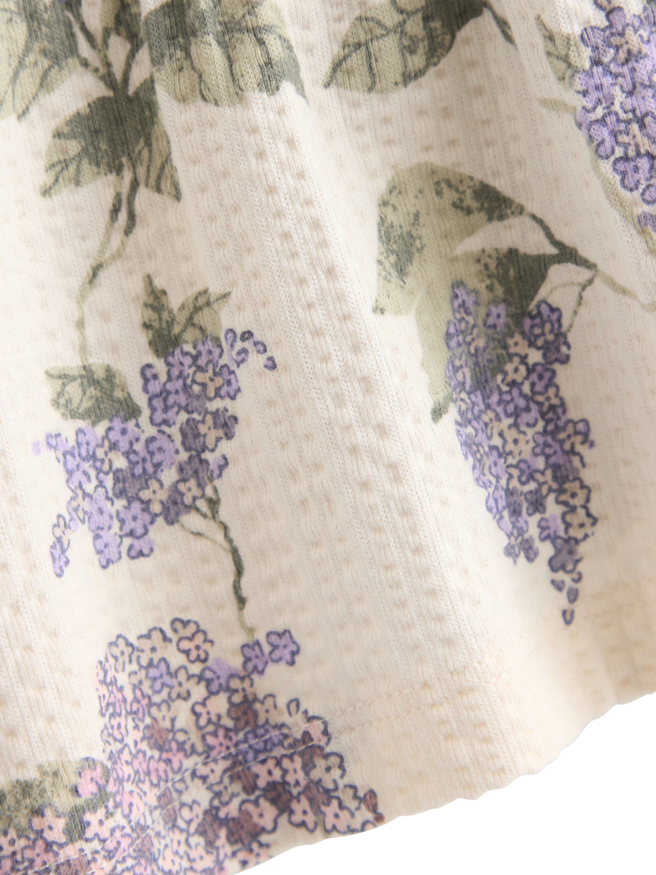 Short-sleeved top with peplum fit a