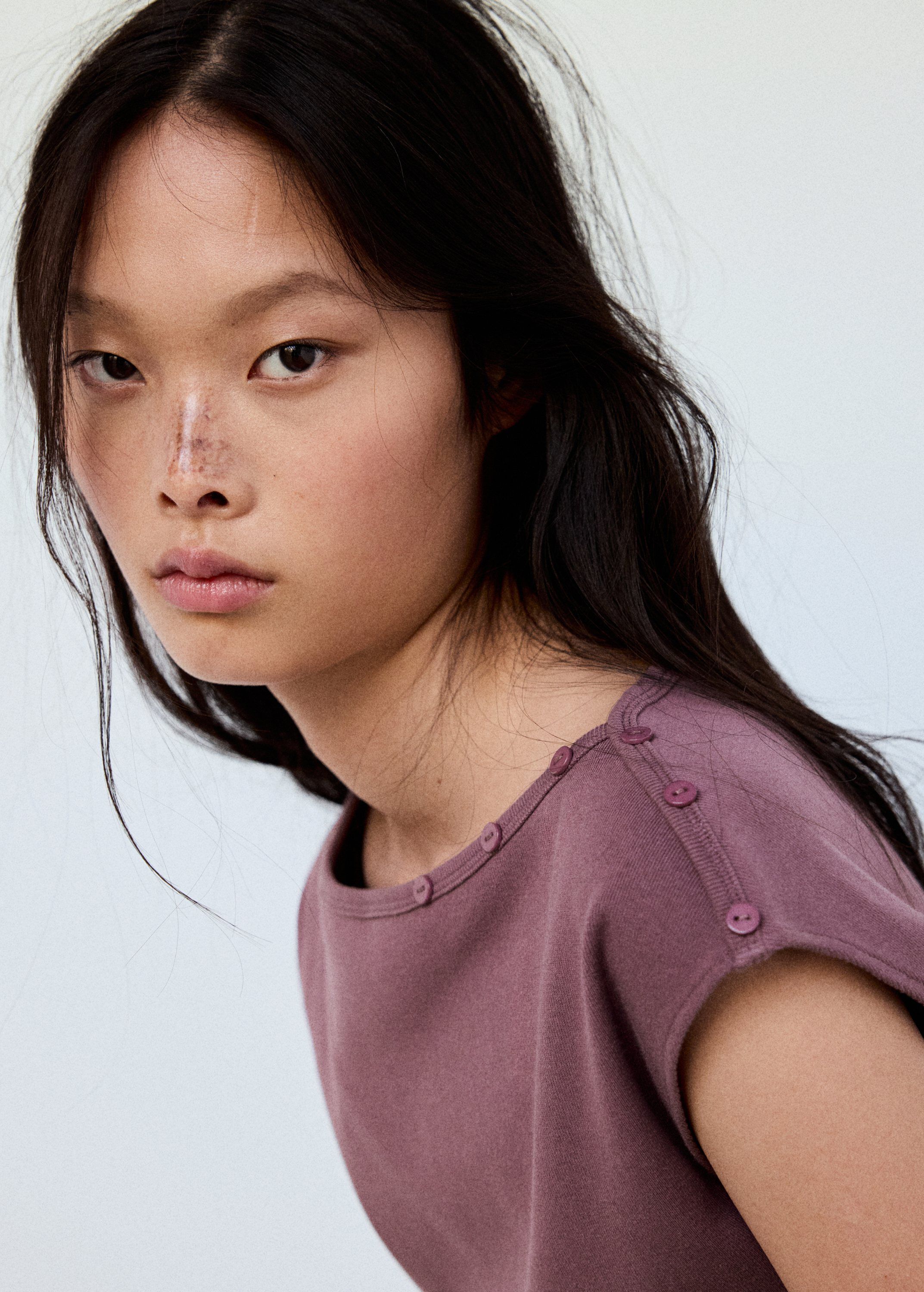 Boat neck top with decorative butto