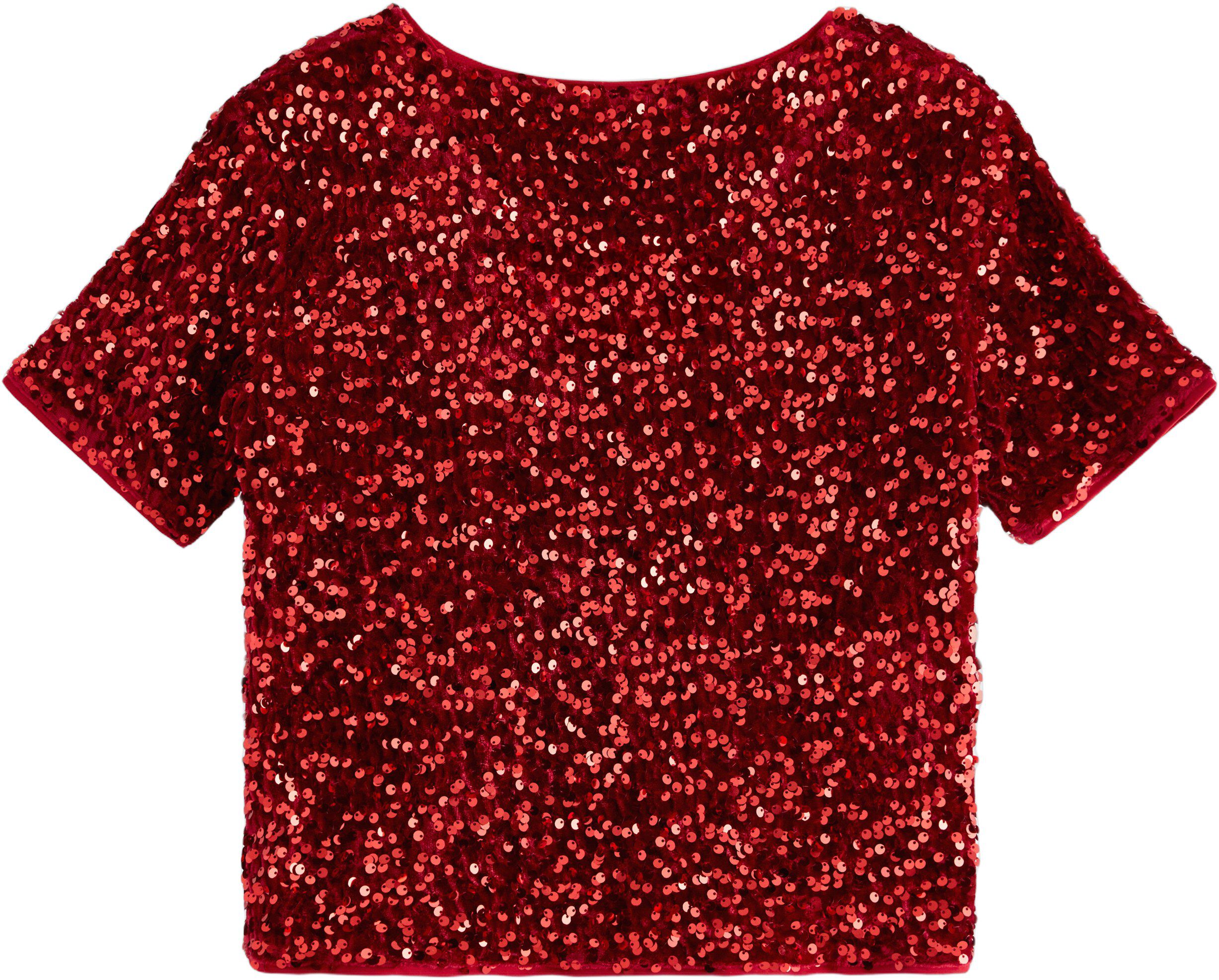 Glitrende kortermet topp med fl&oslash;yel