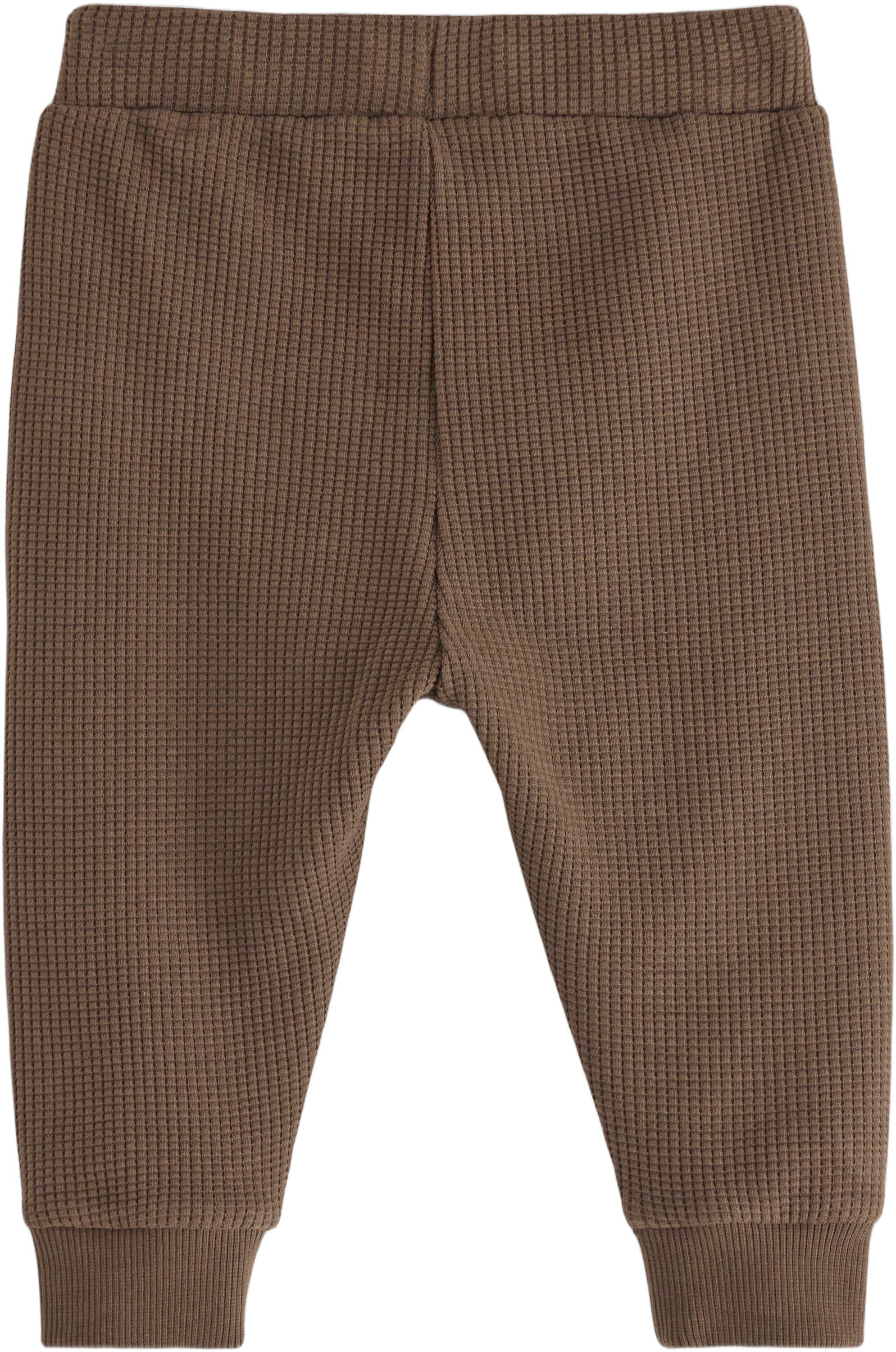 Joggers in waffled cotton with appl