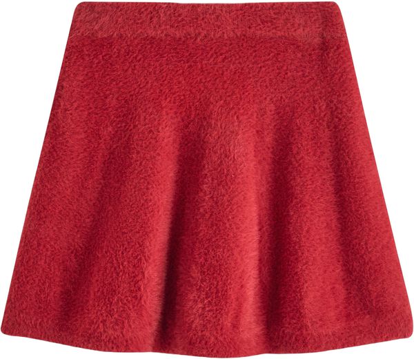 Mjukt utsvängd kjol i fjädergarn.